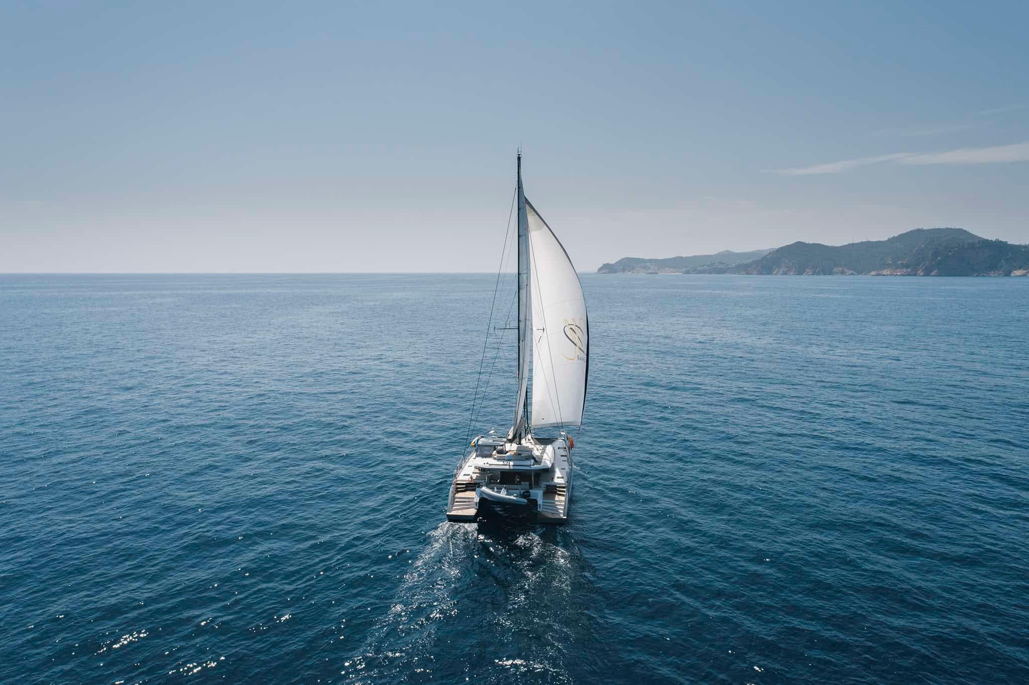 Sailing catamaran Privilege Signature 580, 2025 model, cruising on open sea.