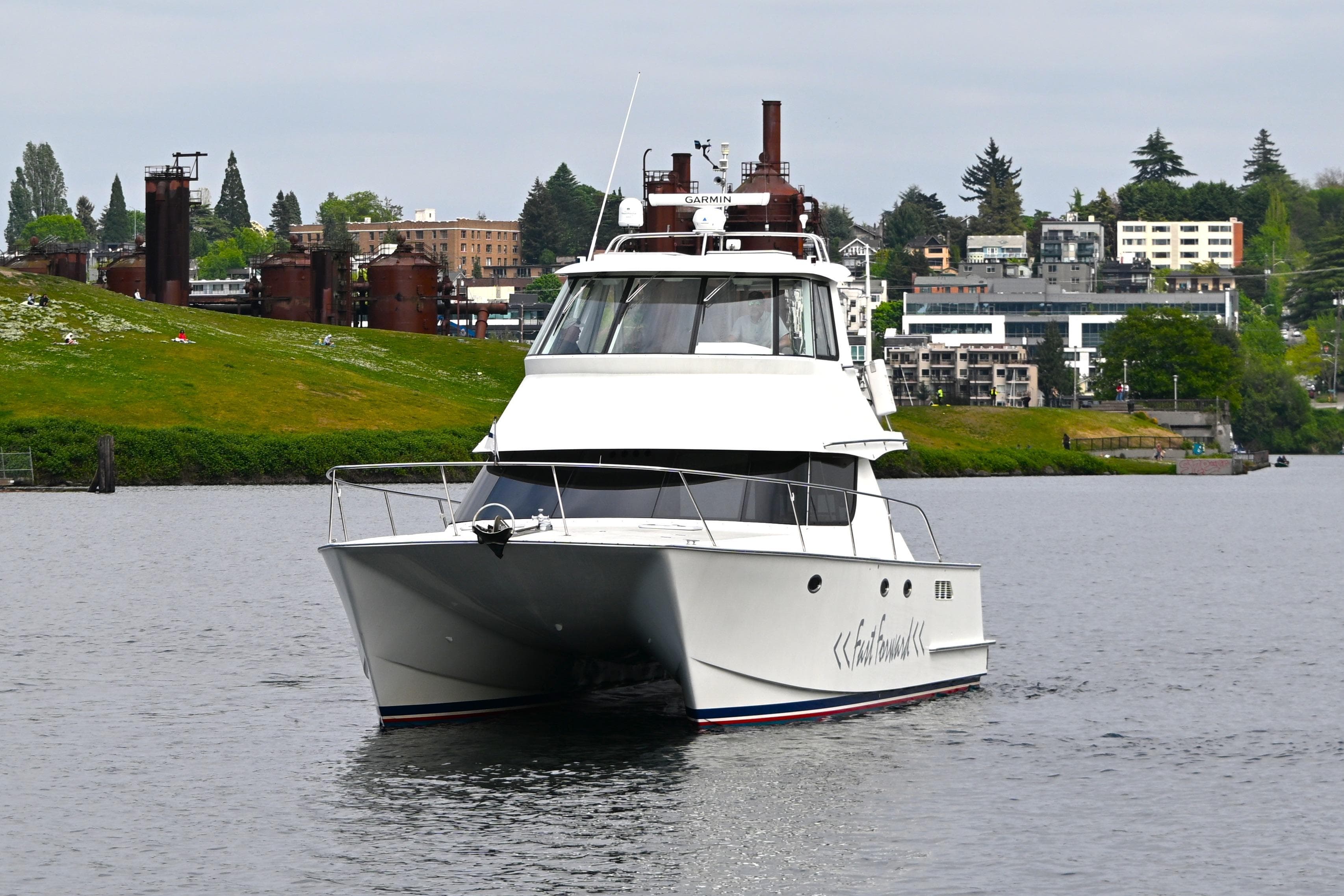 2002 Roger Hill Power Cat 41.4 cruising on a scenic waterway.