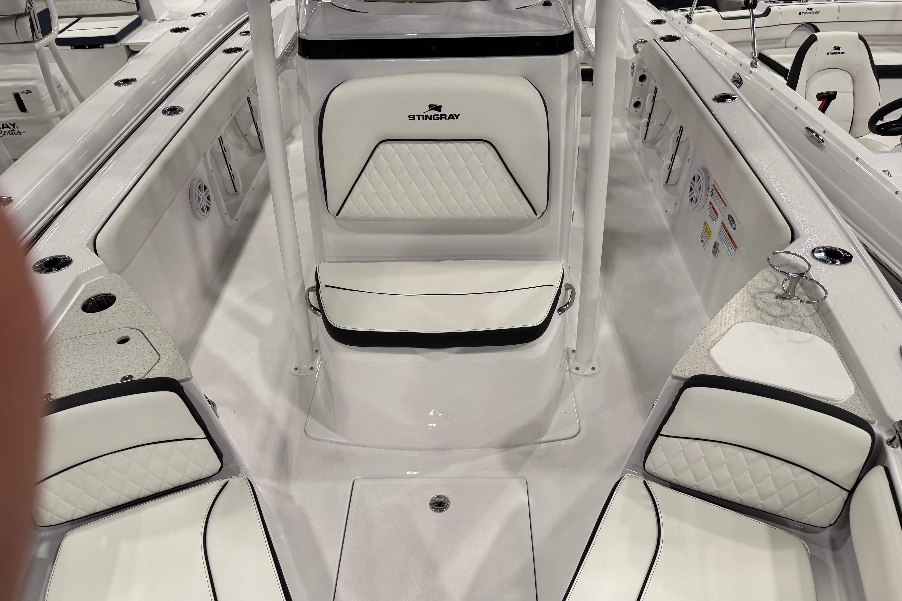 2026 Stingray 216 CC boat interior with white seating and modern design.