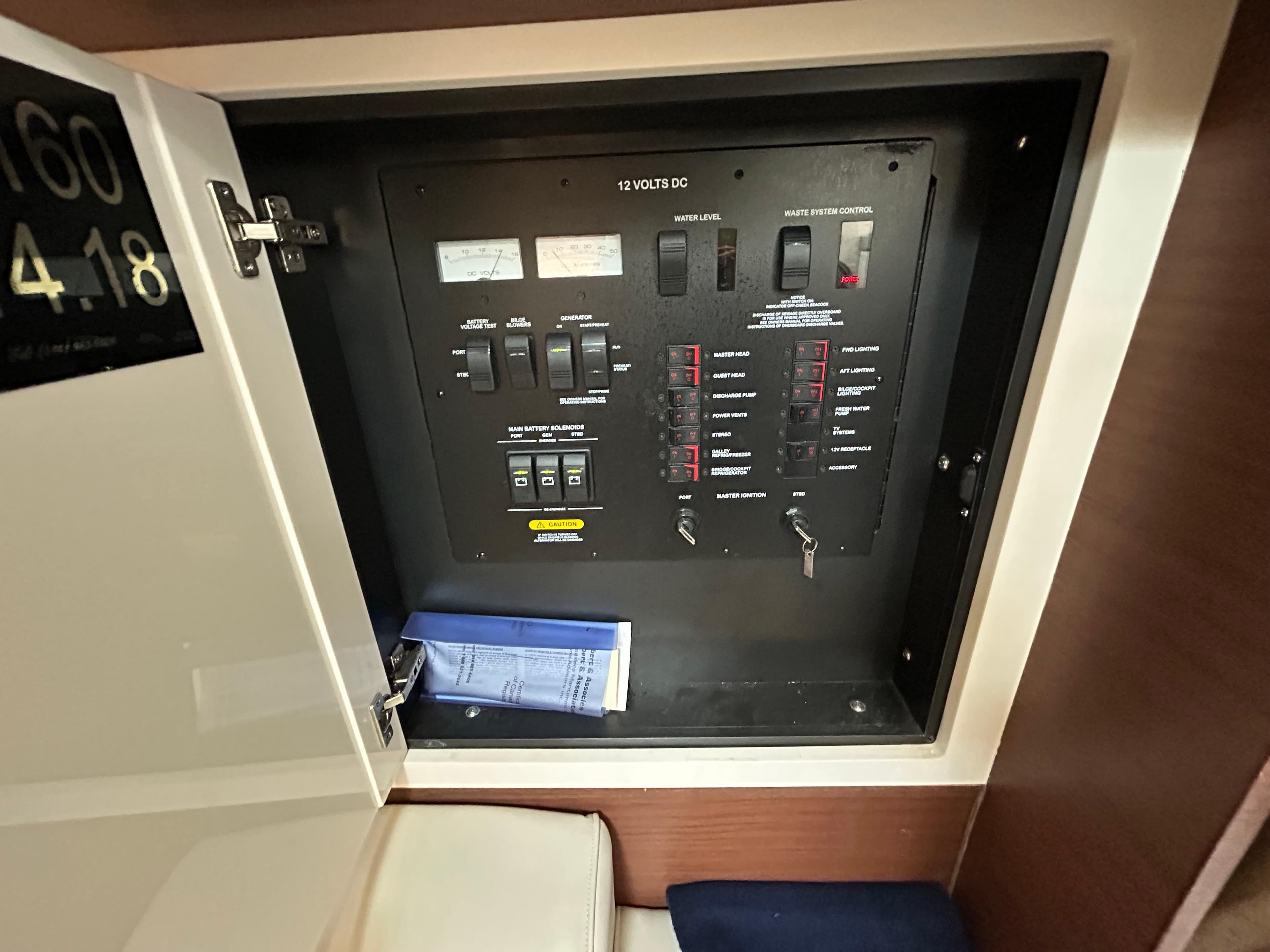 Electrical panel inside 2015 Sea Ray 410 Sundancer yacht, showing switches and controls.