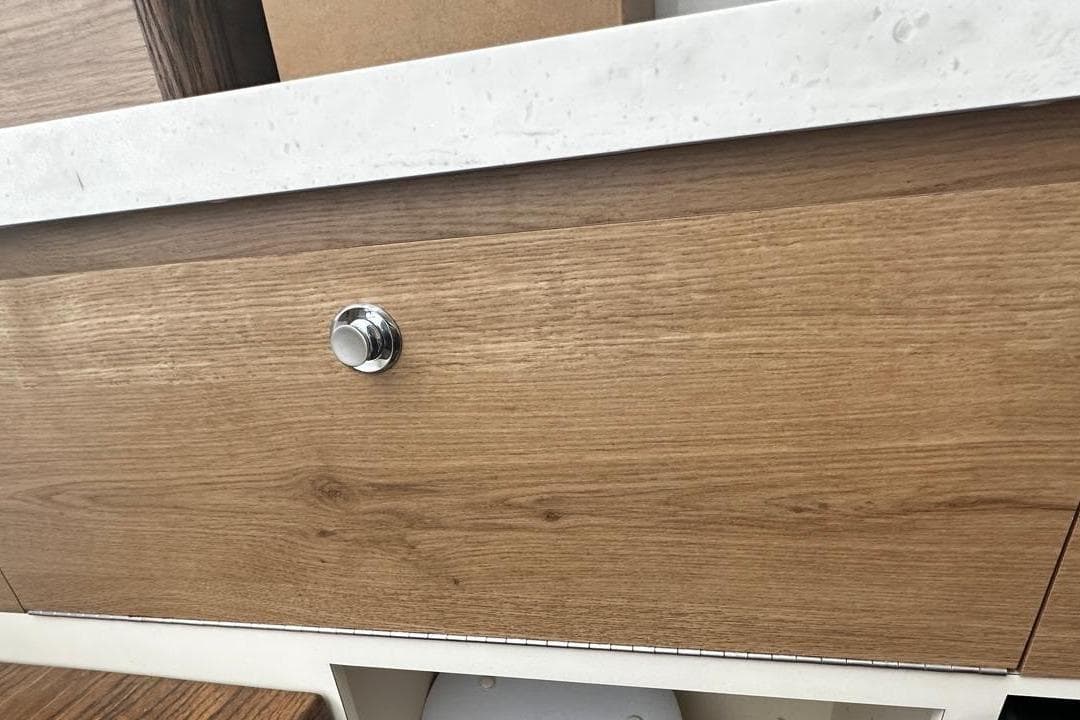 Wooden cabinet with chrome knob on Bertram 39 CC, 2022 model.