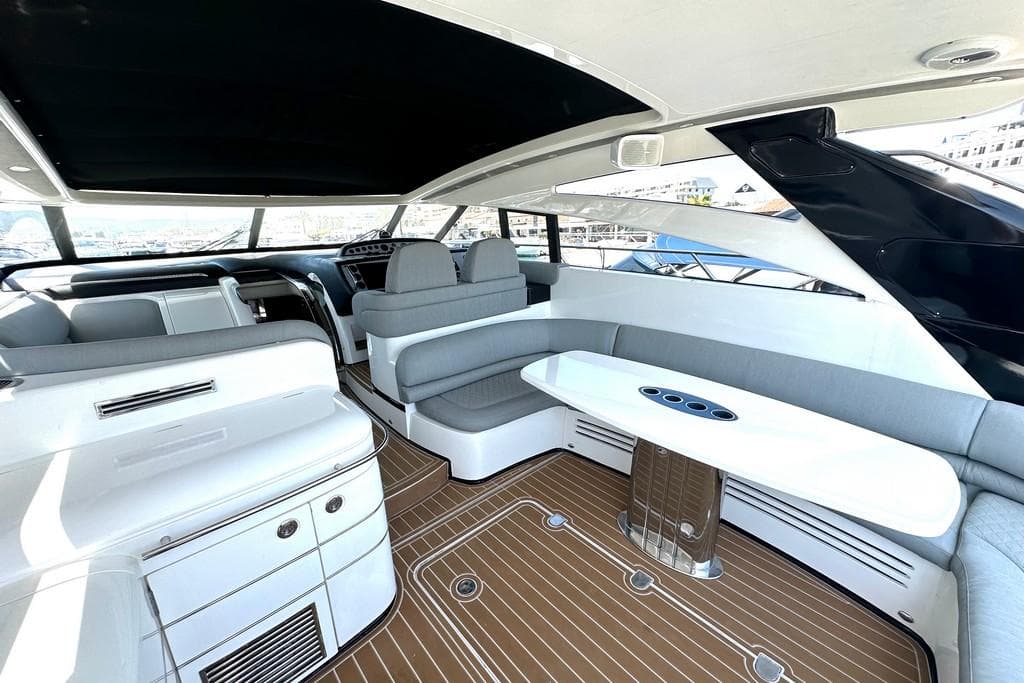 Luxurious 2005 Princess V58 yacht interior with sleek seating and modern design.
