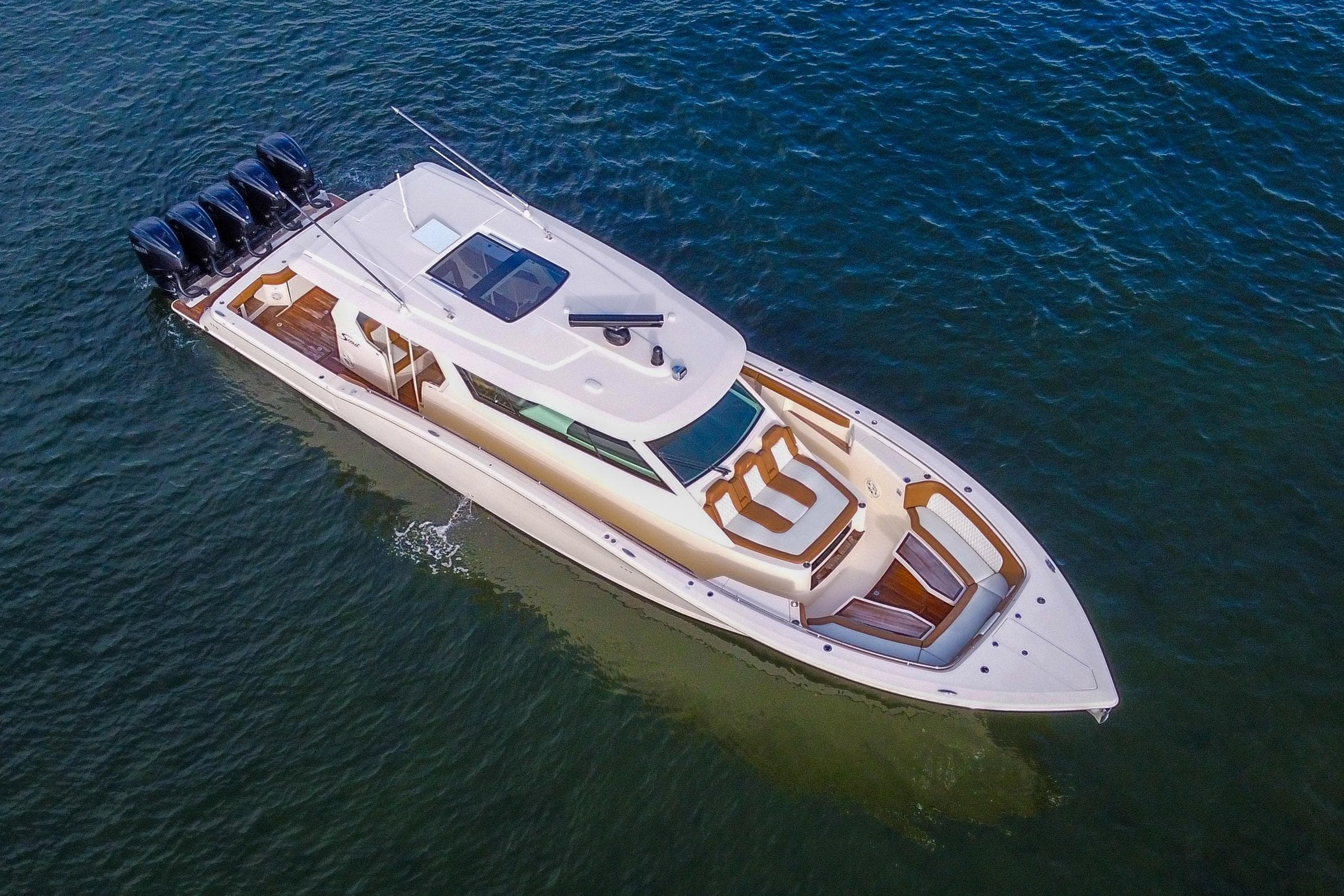 2020 Scout 530 LXF luxury yacht cruising on open water, aerial view.