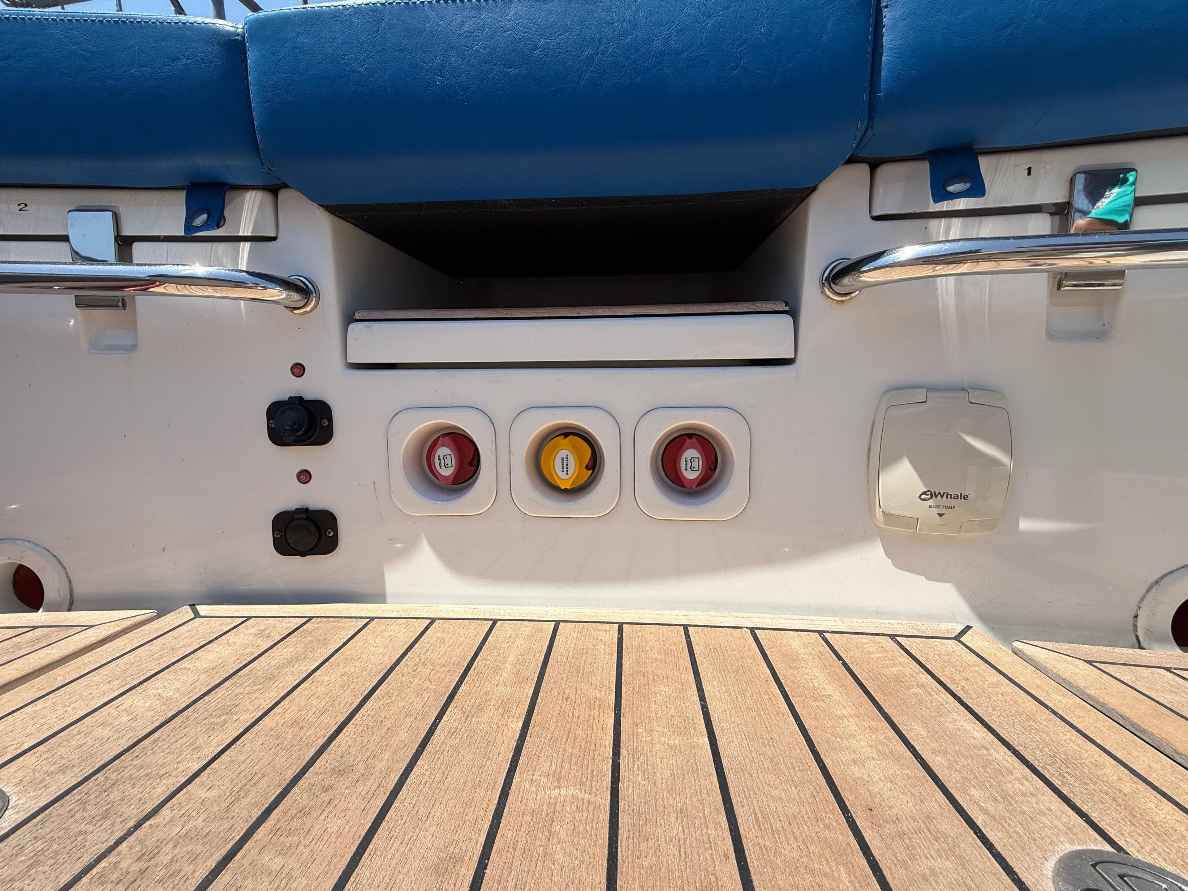 2022 Castoldi jet tender 14RB SOLAS, control panel with switches and teak flooring.