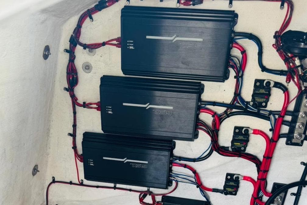 Electrical system of a 2005 Carrera Boats 32, featuring neatly arranged wiring and components.