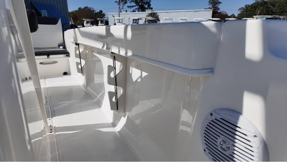 2025 Bayliner Trophy 20 boat interior with rod holders and speaker.