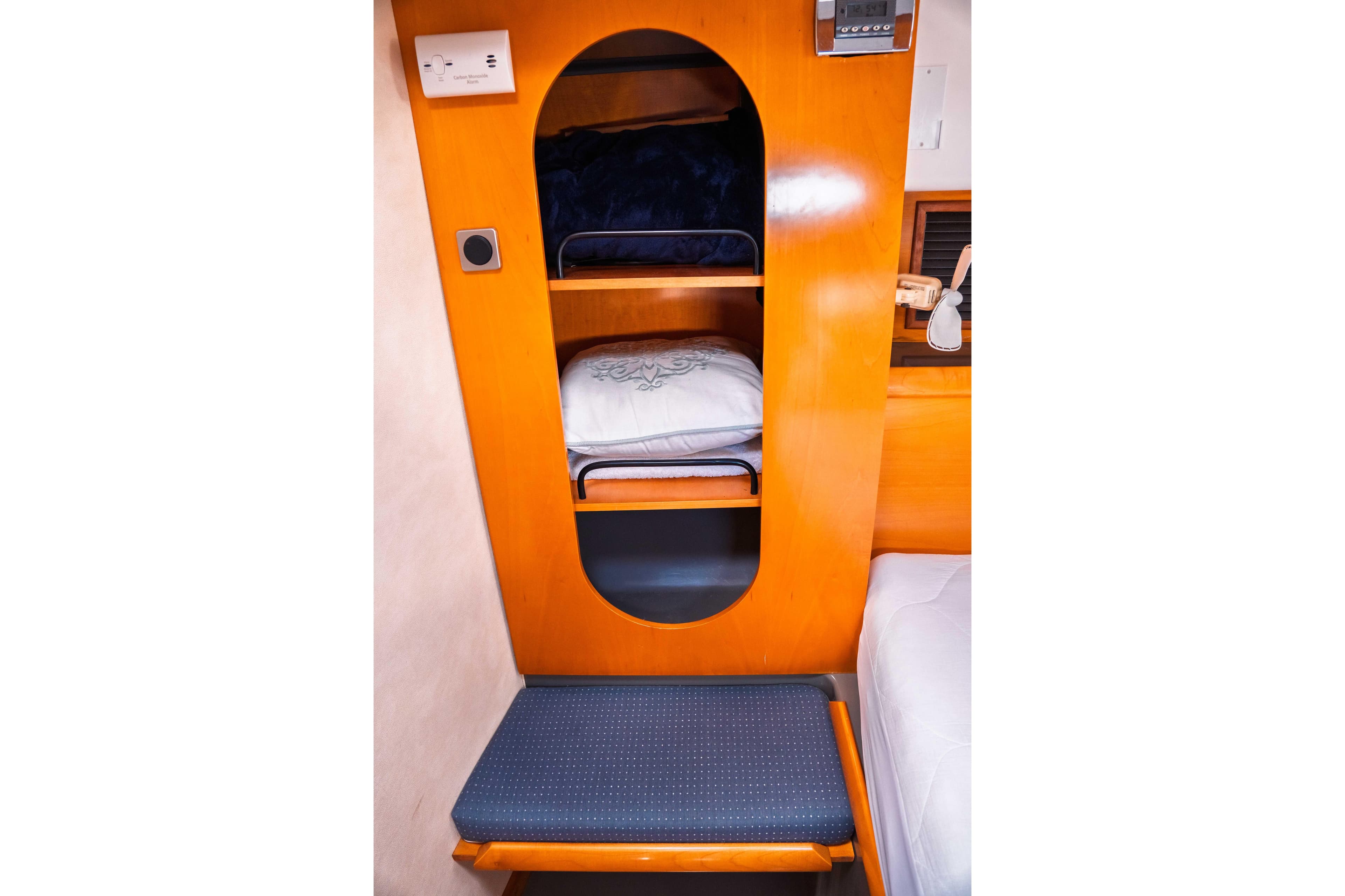Interior of 2005 Fountaine Pajot LAVEZZI 40 yacht with wooden shelving and seating.