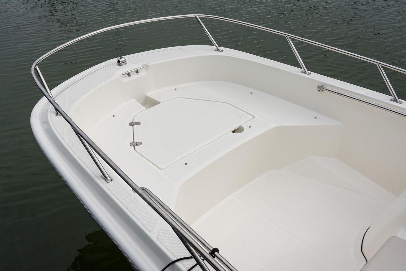 Manufacturer Provided Image: 2026 Boston Whaler 160 Super Sport boat deck with railing on calm water.