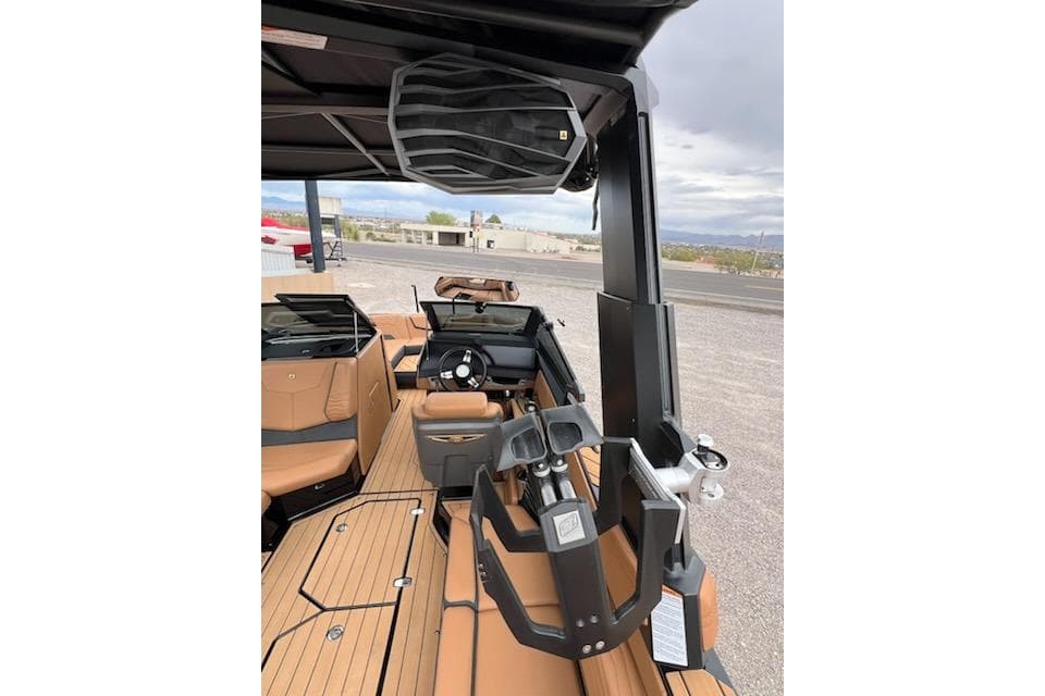 2025 Nautique Super Air Nautique G23 interior with tan seating and modern dashboard.