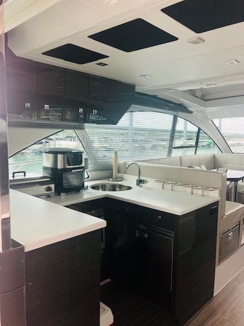 Interior of 2019 Cruisers Yachts 50 Cantius with modern kitchen.