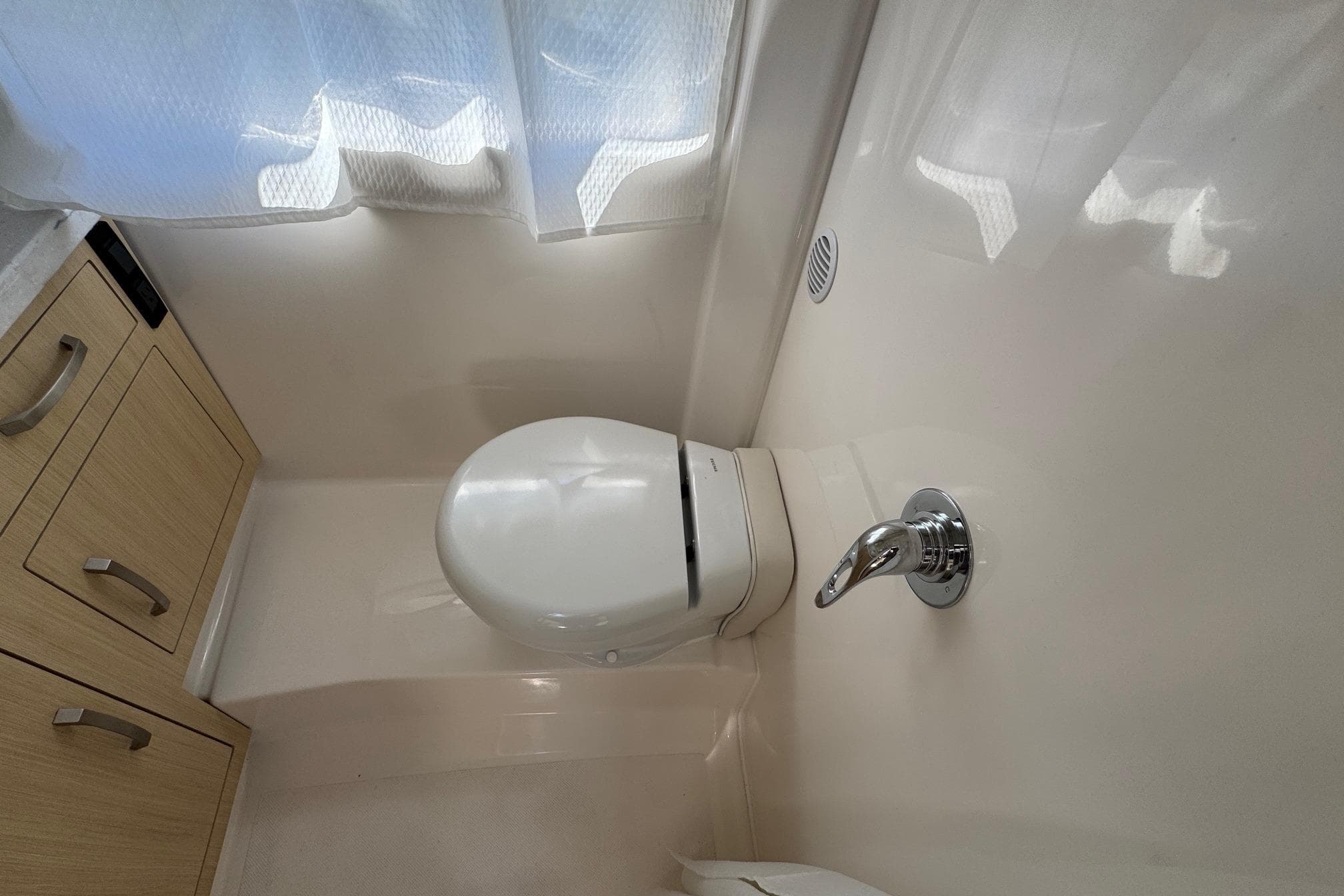 Bathroom interior of 2026 Regal 33 XO boat with modern fixtures.
