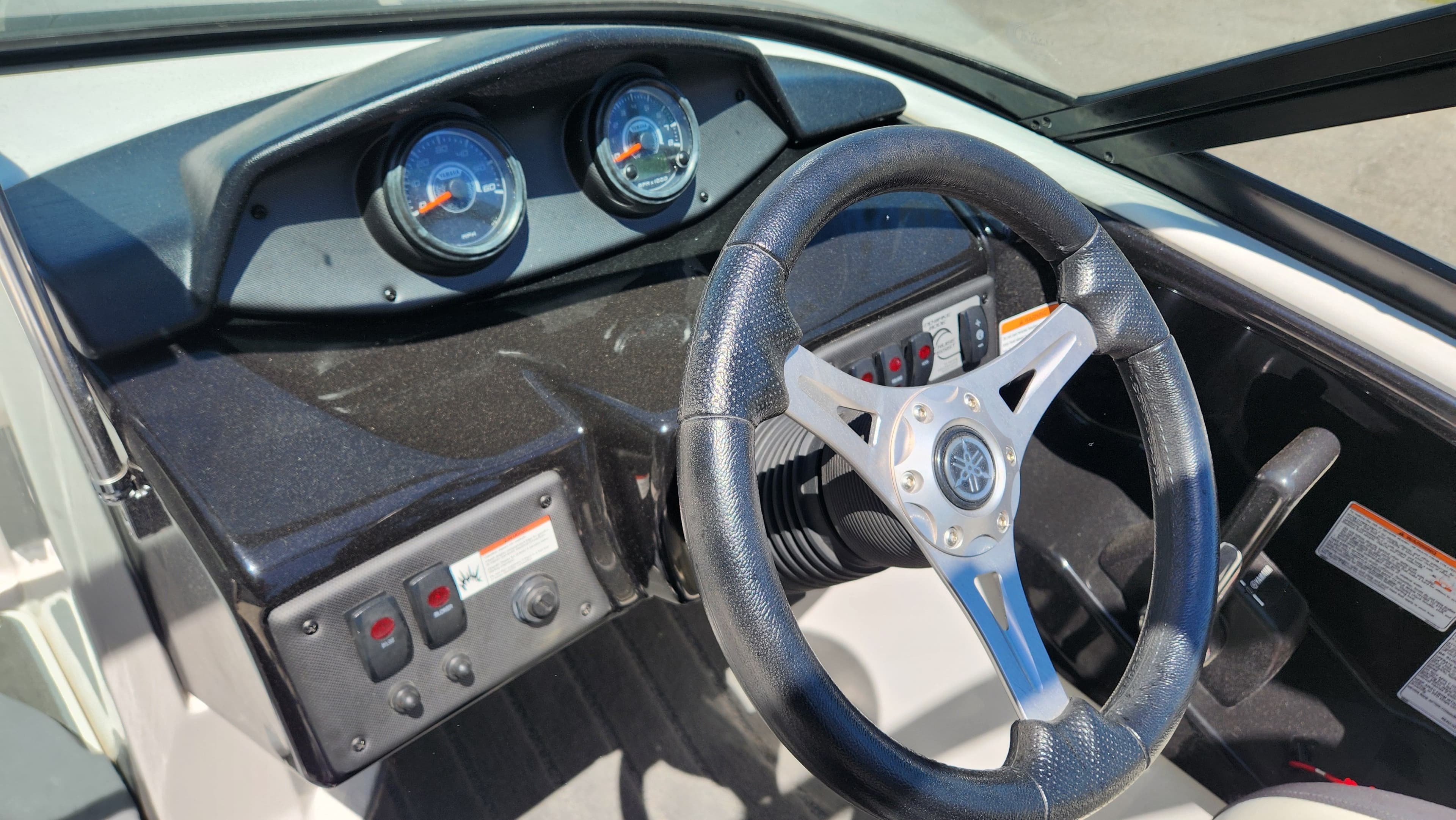 Steering wheel and dashboard of a 2016 Yamaha Boats AR192.