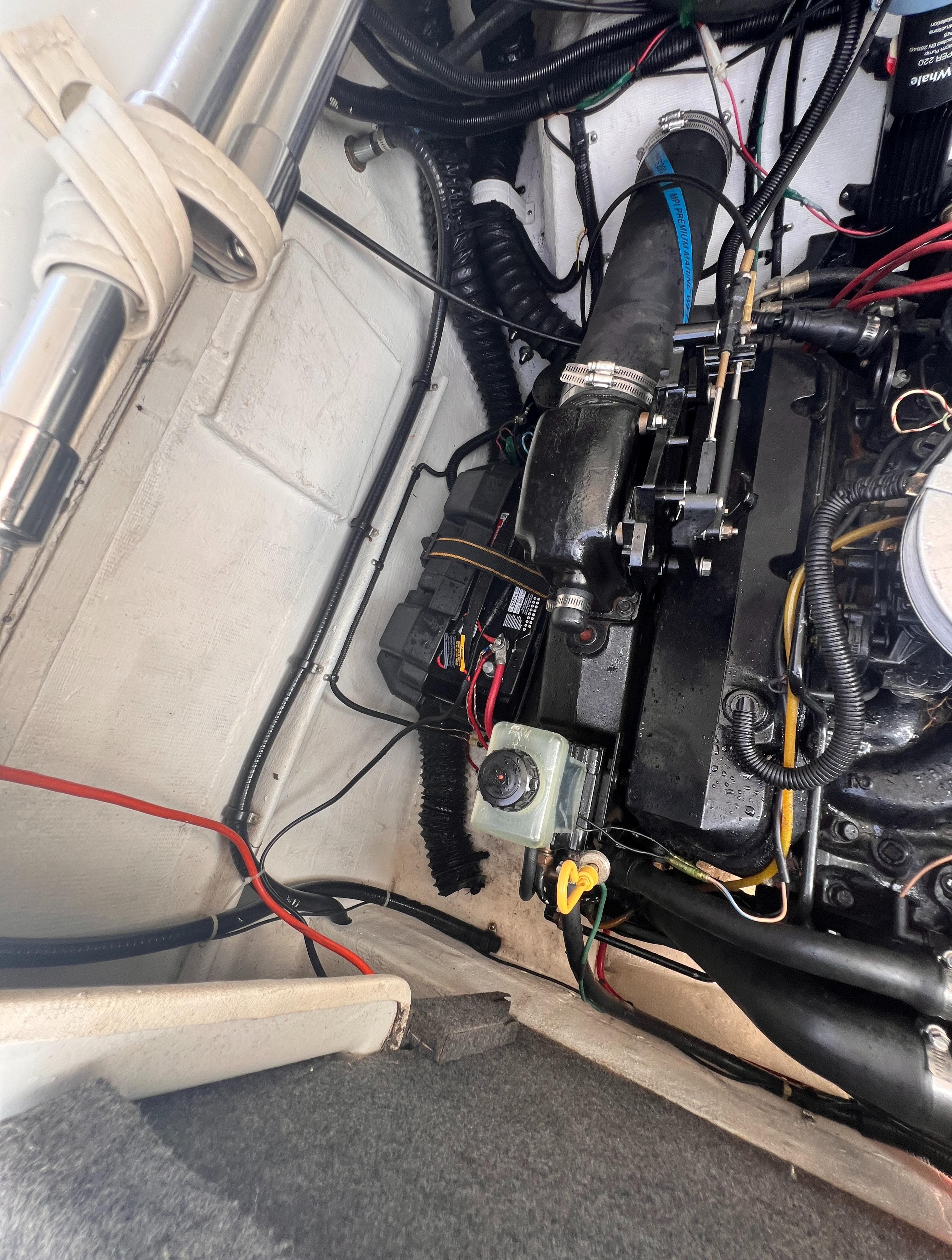 Engine compartment of 1995 Powerquest 290 Enticer FX boat, showing wiring and components.