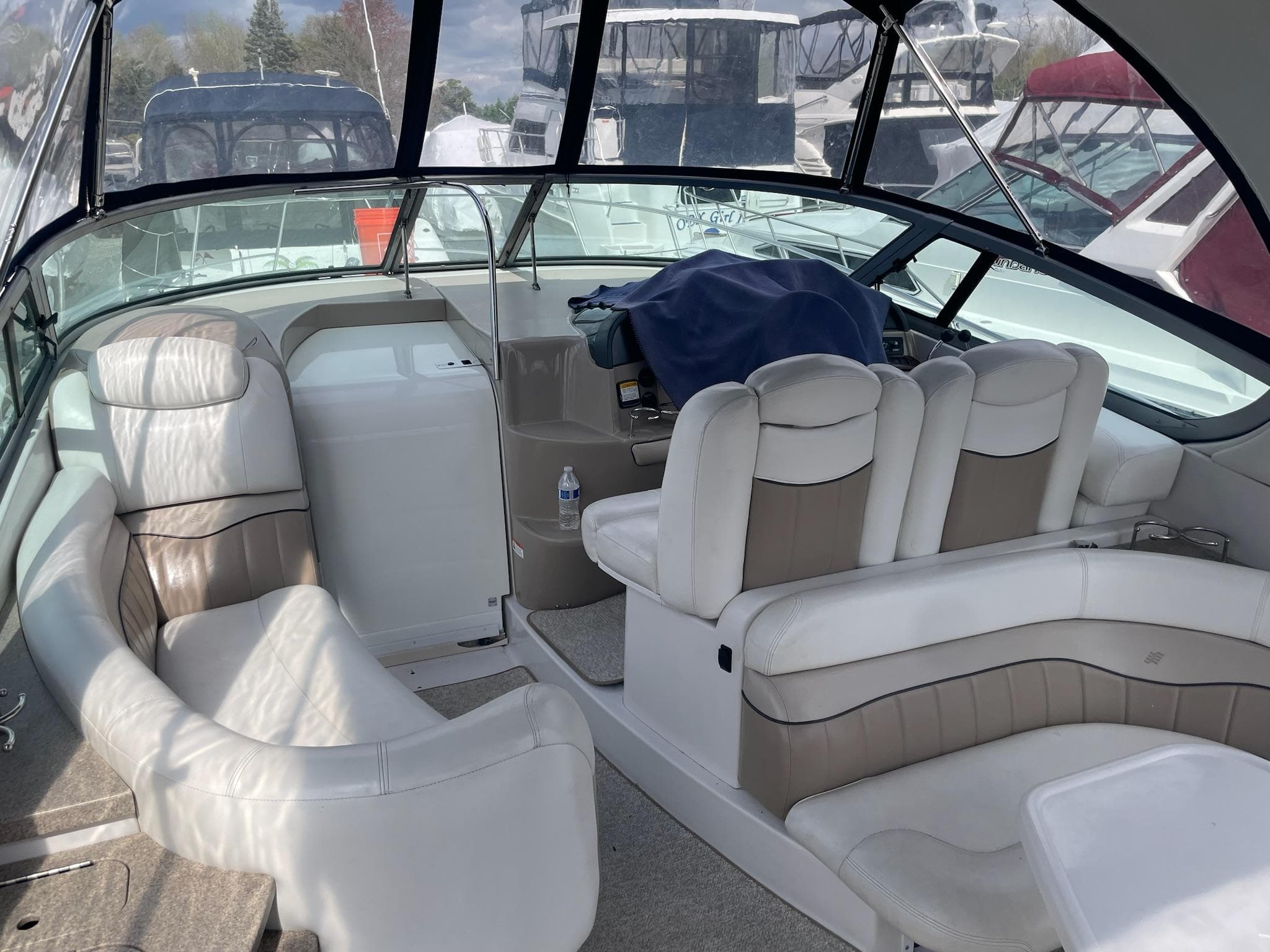 Interior of a 2005 Four Winns 348 Vista yacht with white seating.