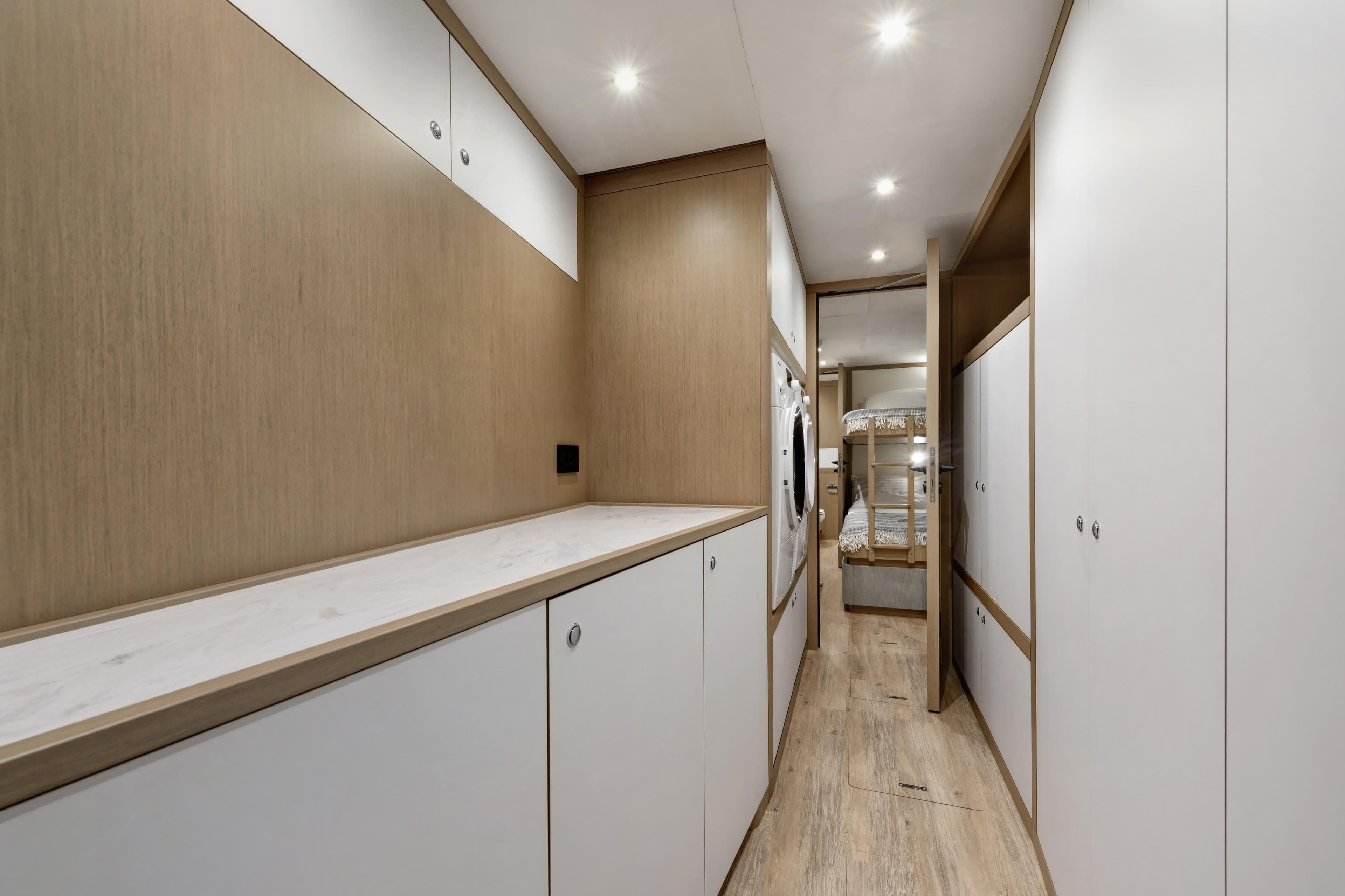 Modern interior of 2027 Lazzara LPC 300 yacht with sleek cabinetry and ambient lighting.