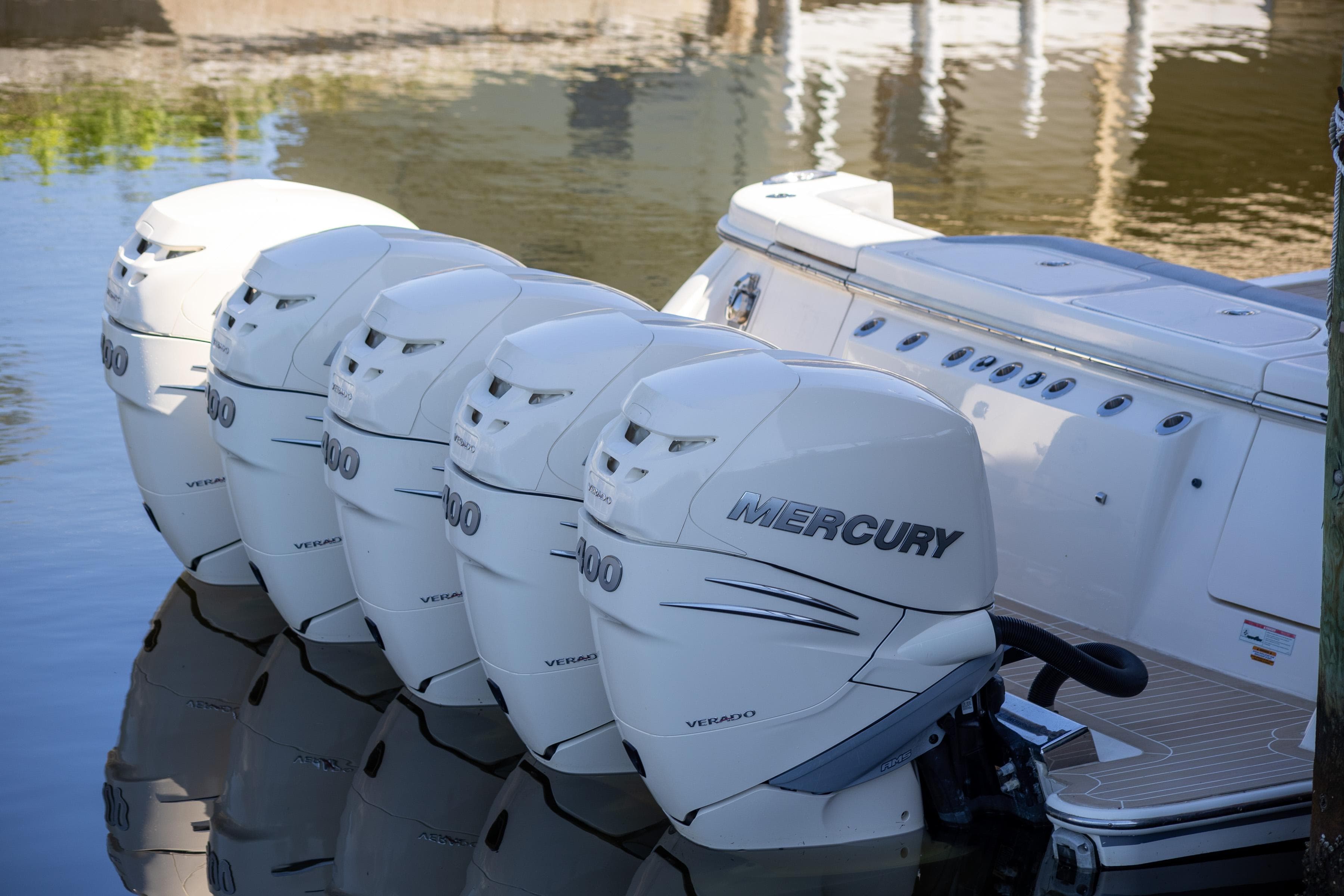 2020 Scout 530LXF boat with five Mercury outboard engines on water.