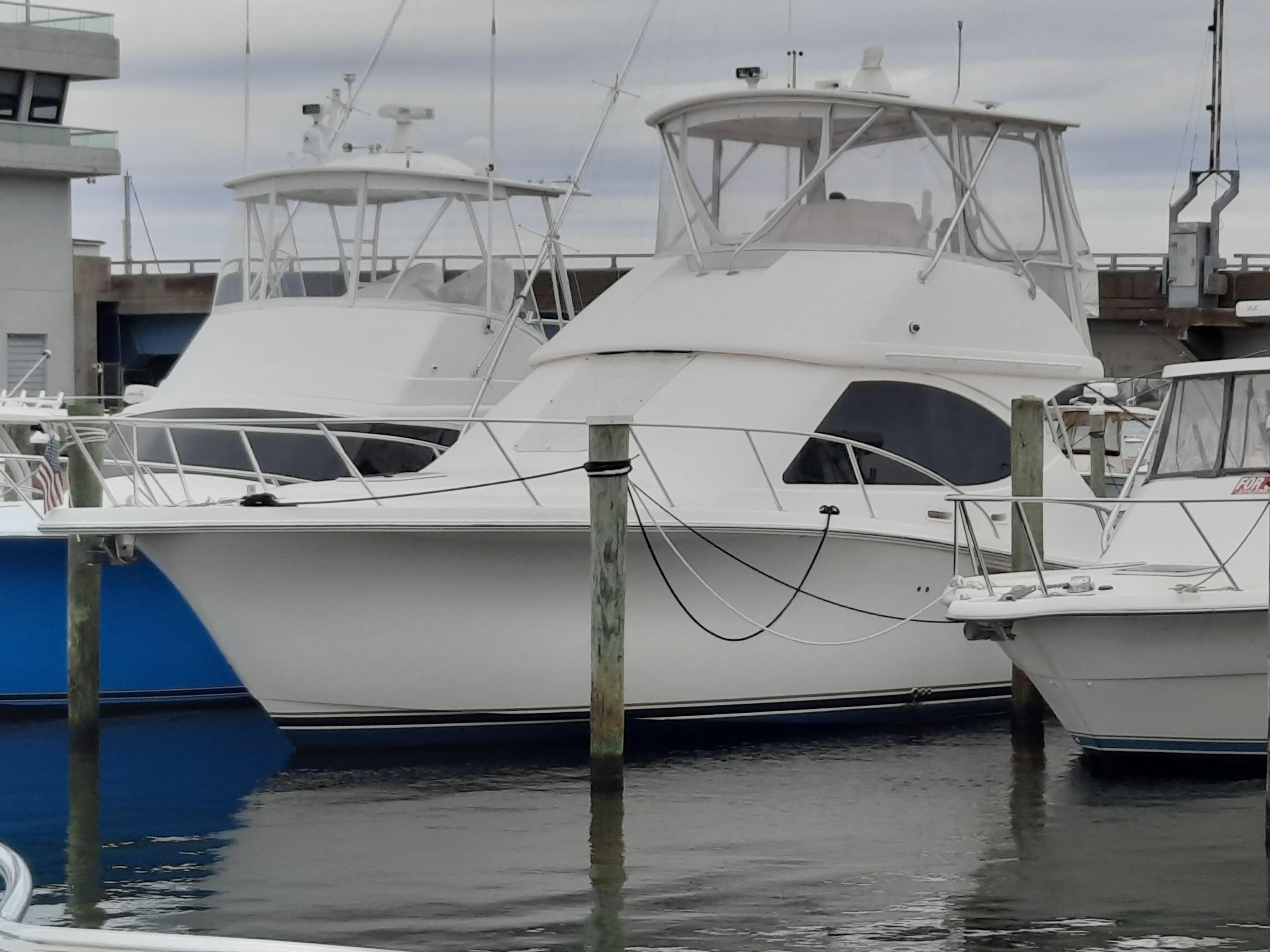2008 Tiara Yachts 3900 Convertible docked at marina.