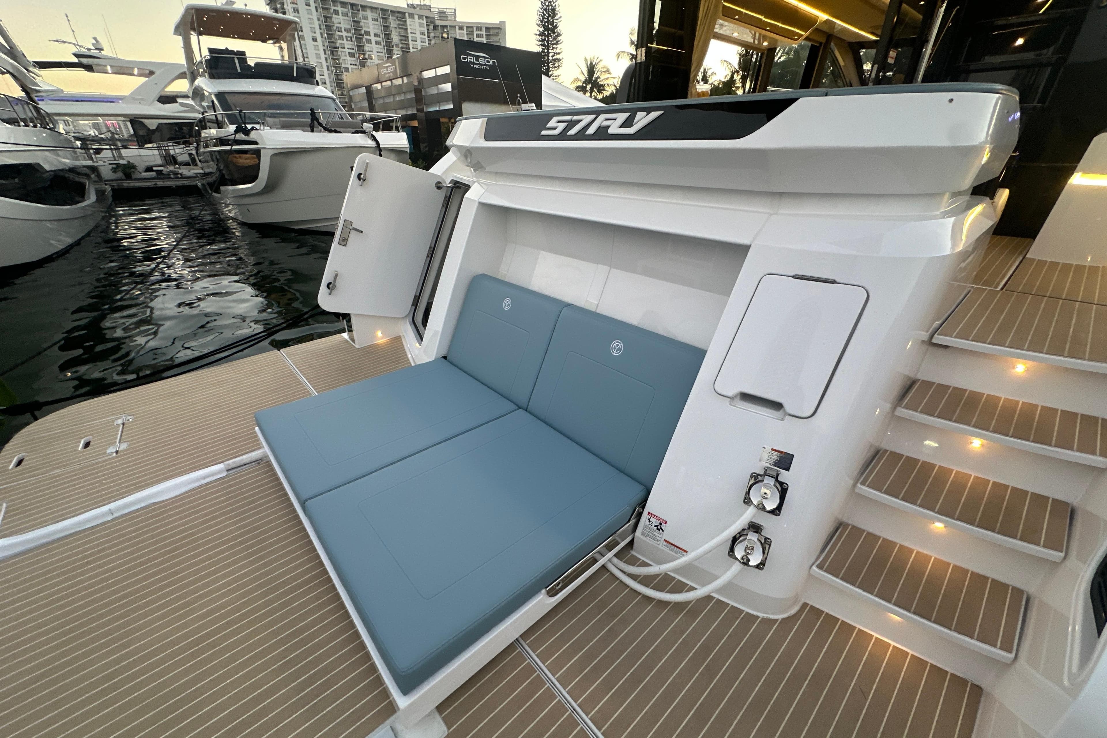 2026 Cruisers Yachts 57 Fly with open deck seating and modern design at marina.