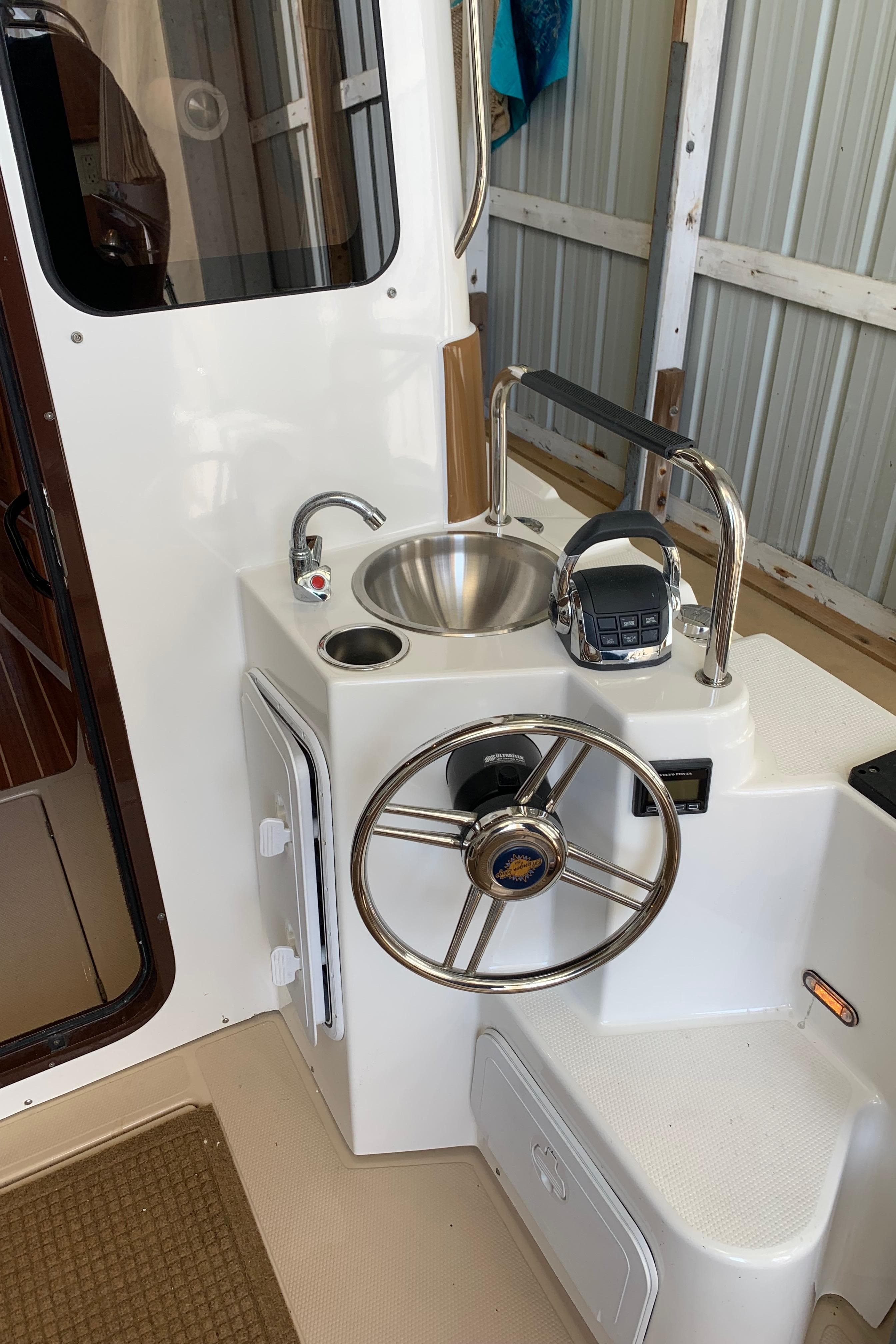 2014 Ranger Tugs Trawler helm station with sink and controls.