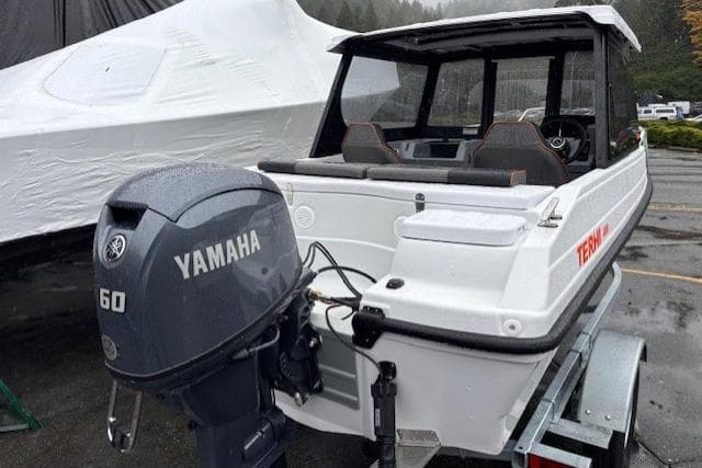 2026 Terhi 480 Cabin boat with Yamaha 60 engine on trailer.