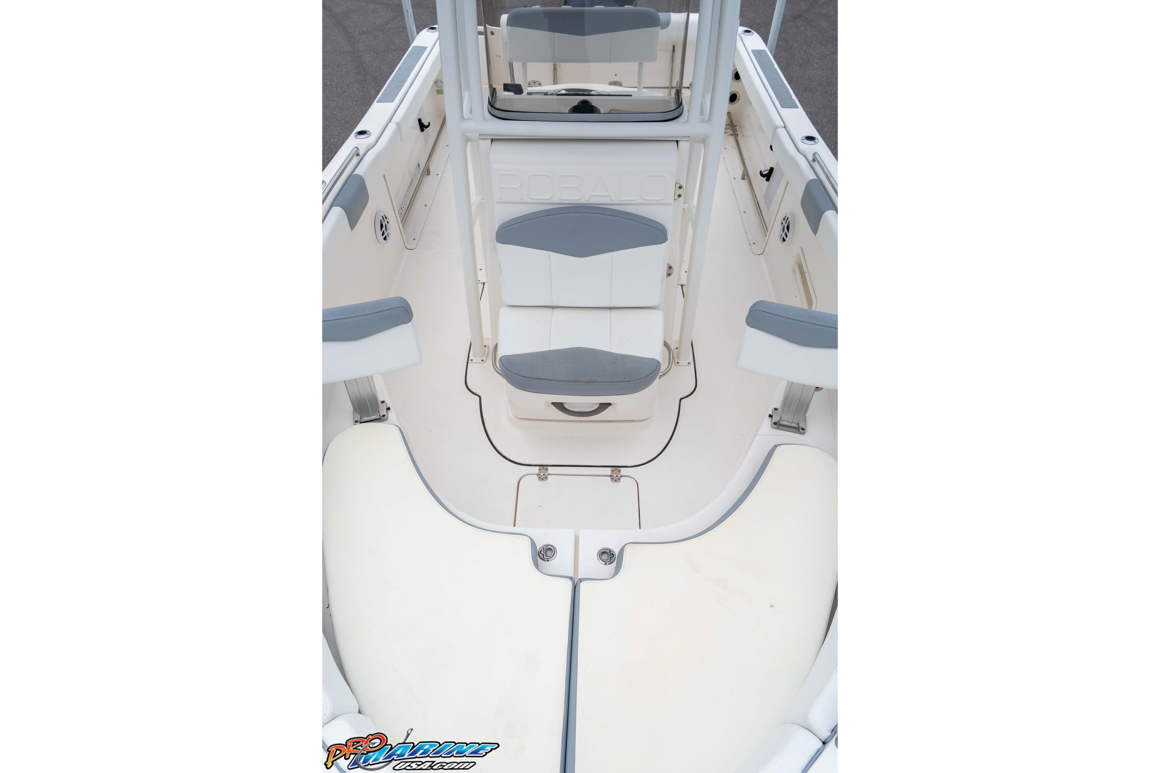 2021 Robalo R222 Center Console boat interior with seating and storage compartments.