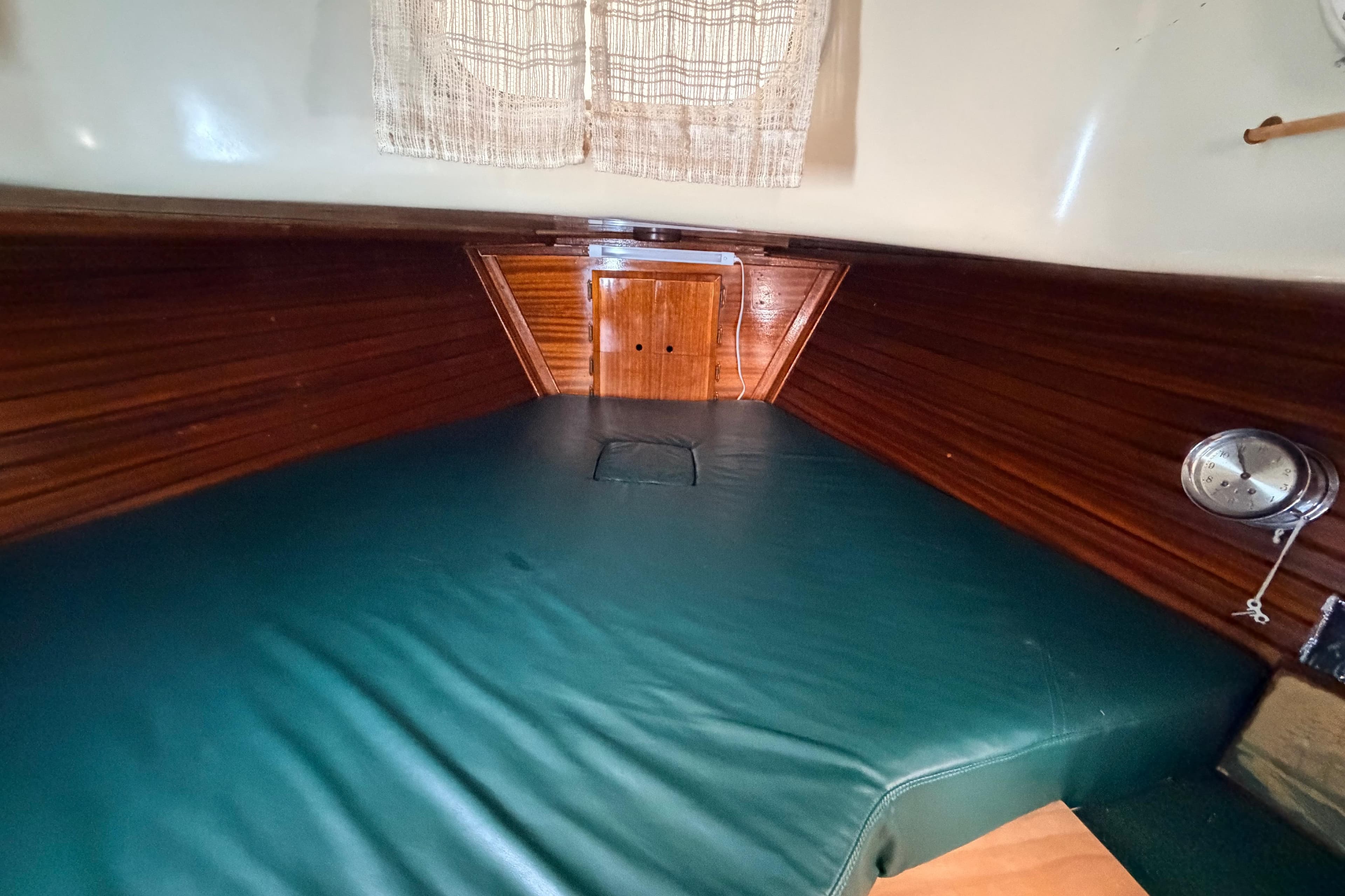 Interior of a 1964 Columbia 33 yacht with wooden walls.