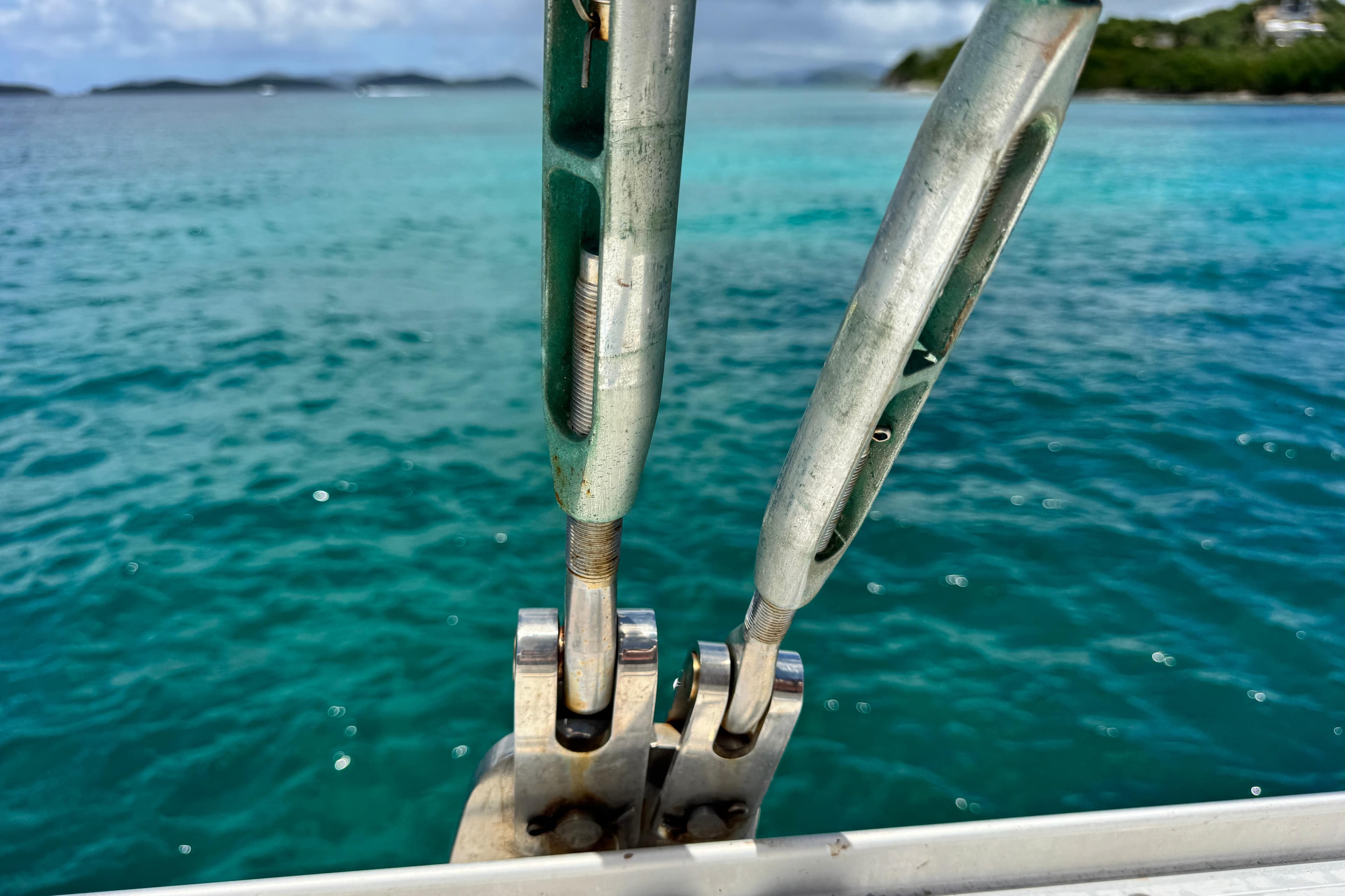 Close-up of Leopard 46 yacht rigging against turquoise ocean backdrop, 2011 model.