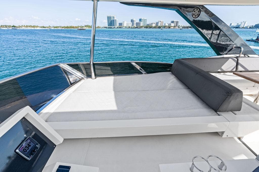Luxurious 2013 Astondoa 72 GLX yacht deck with ocean view and city skyline.