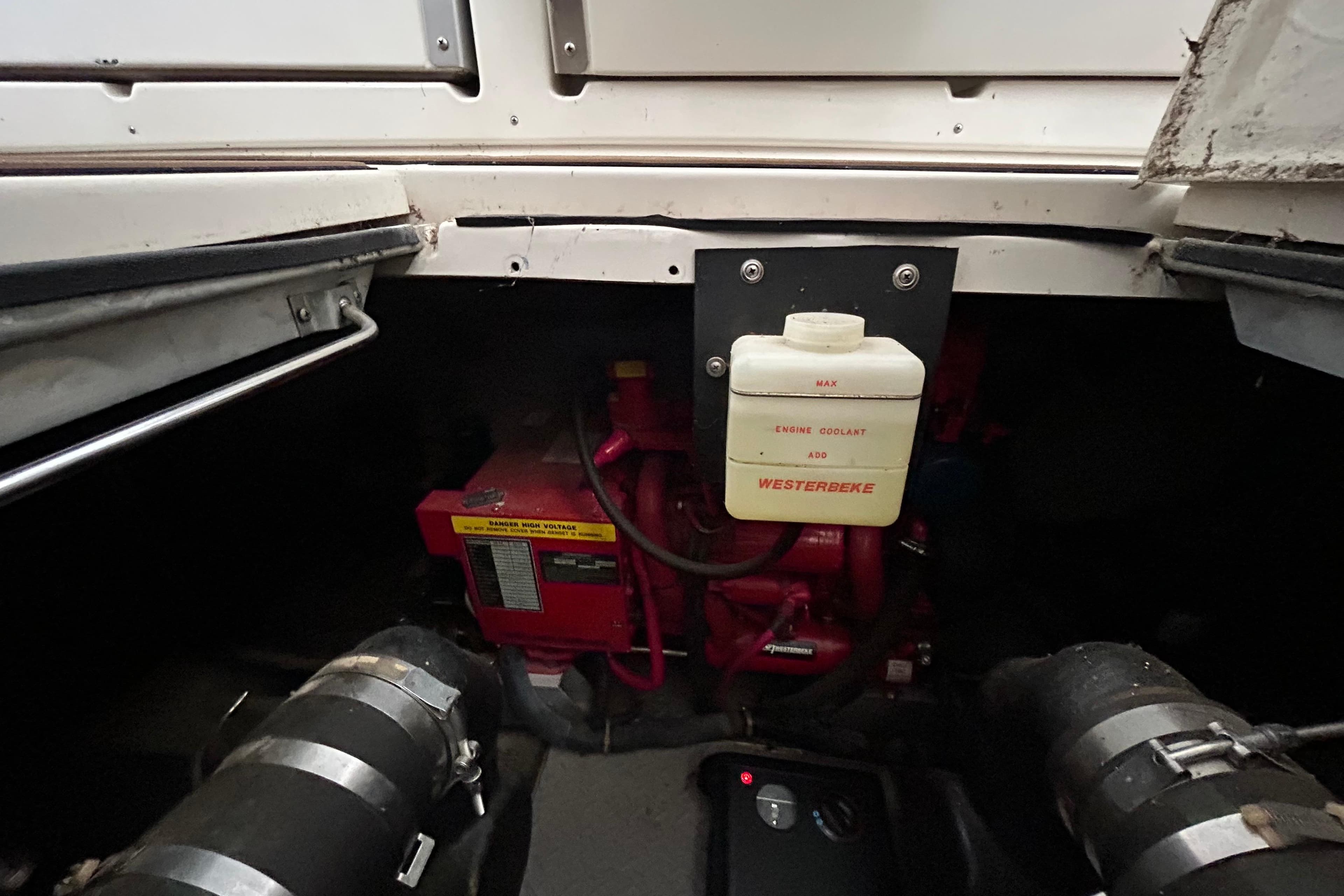 Engine compartment of 2001 Regal Commodore 3880 with Westerbeke engine coolant system.