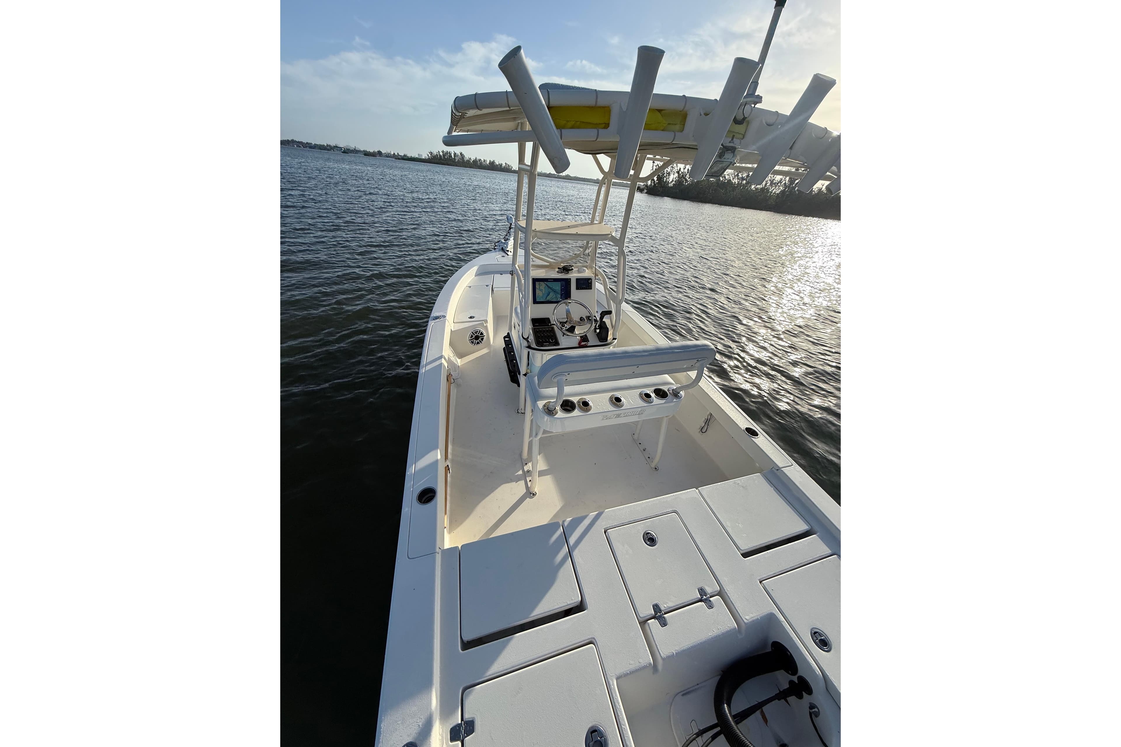 2017 Pathfinder 2200 TRS boat on calm water, featuring a spacious deck and console.