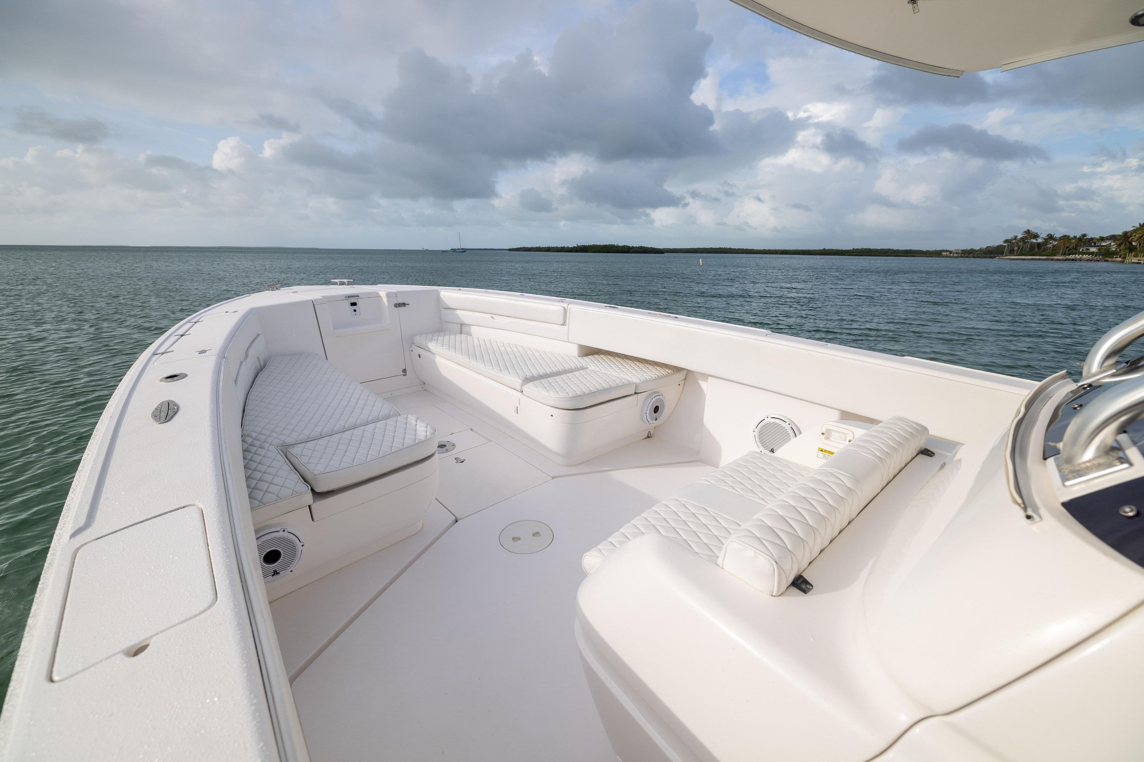 2011 Intrepid 370 Center Console boat with cushioned seating on calm waters.