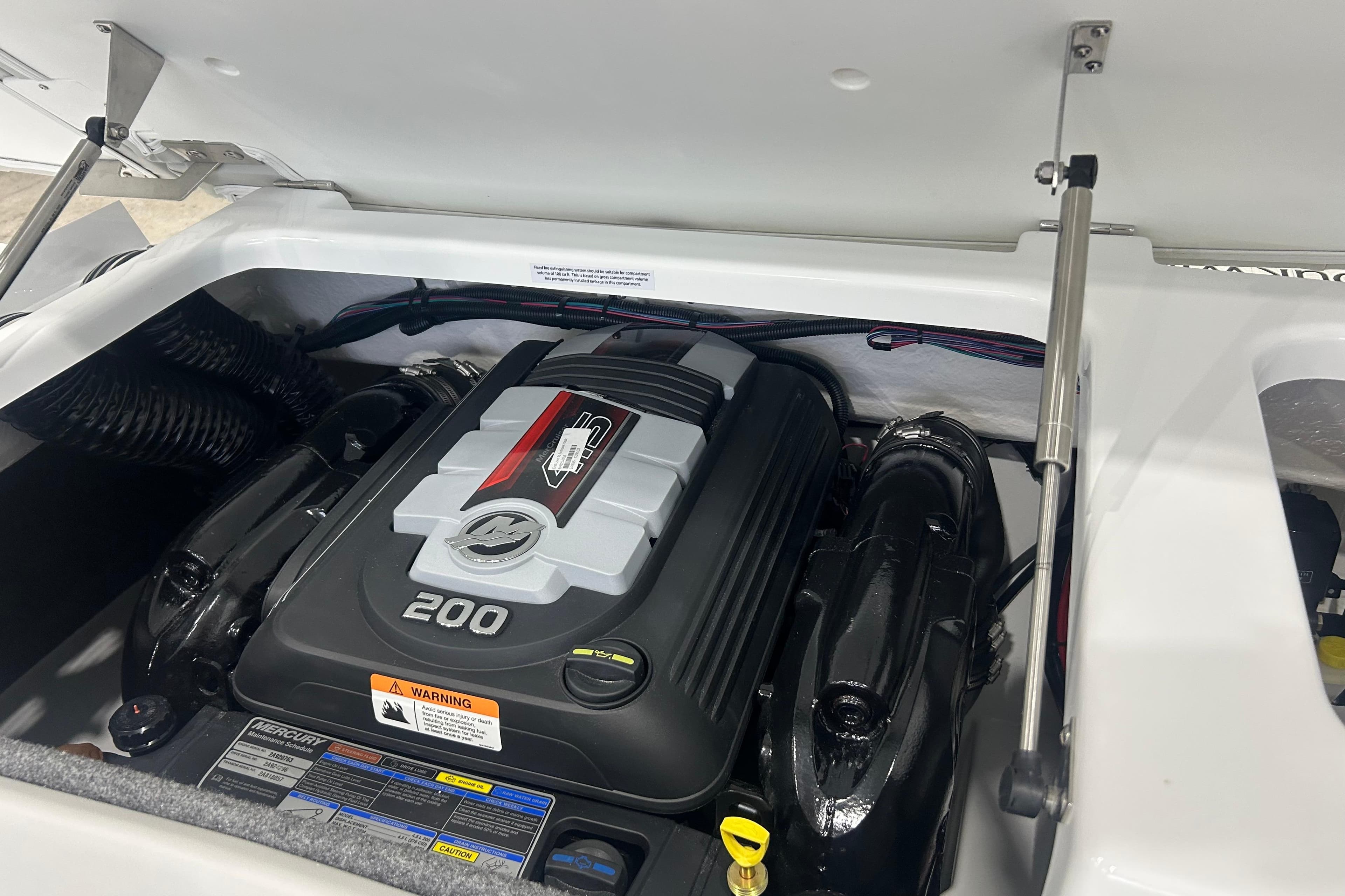 2026 Four Winns H1 Freedom boat engine compartment with Mercury 200 horsepower engine.
