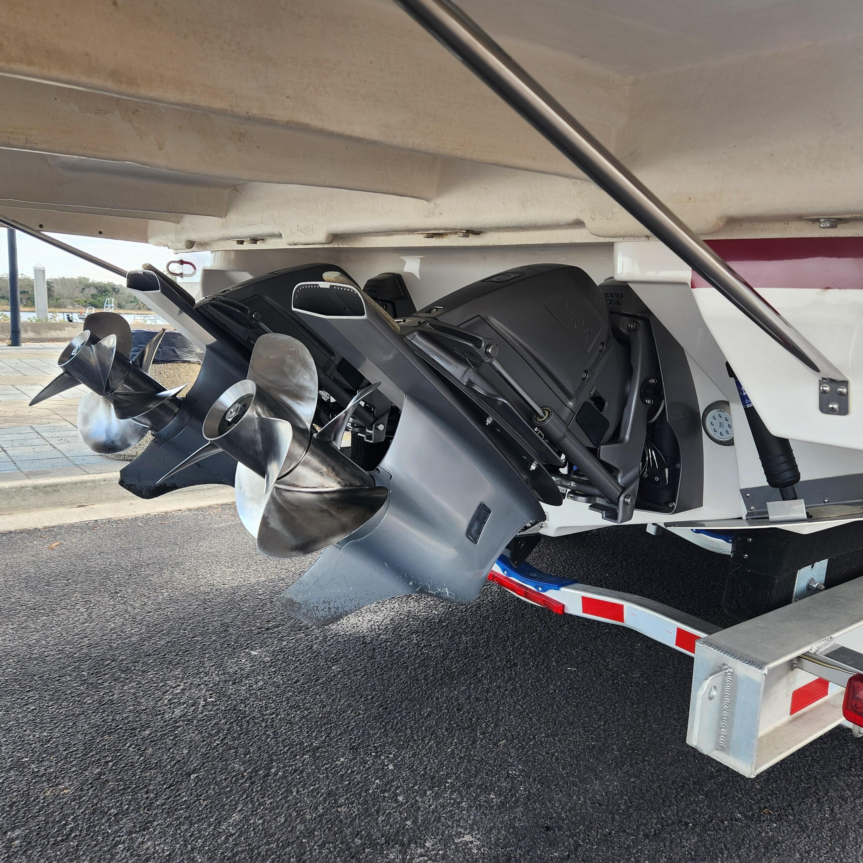 2018 Regal 35 Sport Coupe boat propellers and outboard motors on trailer.