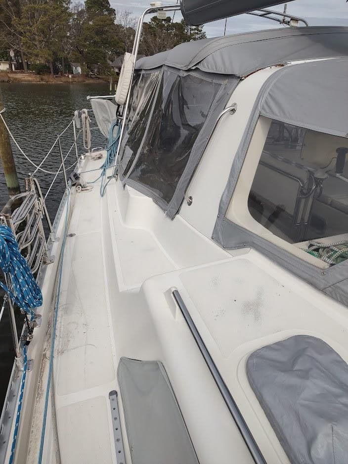 2005 Stevens Custom 53/56 sailboat docked, featuring a covered cockpit and sleek deck design.