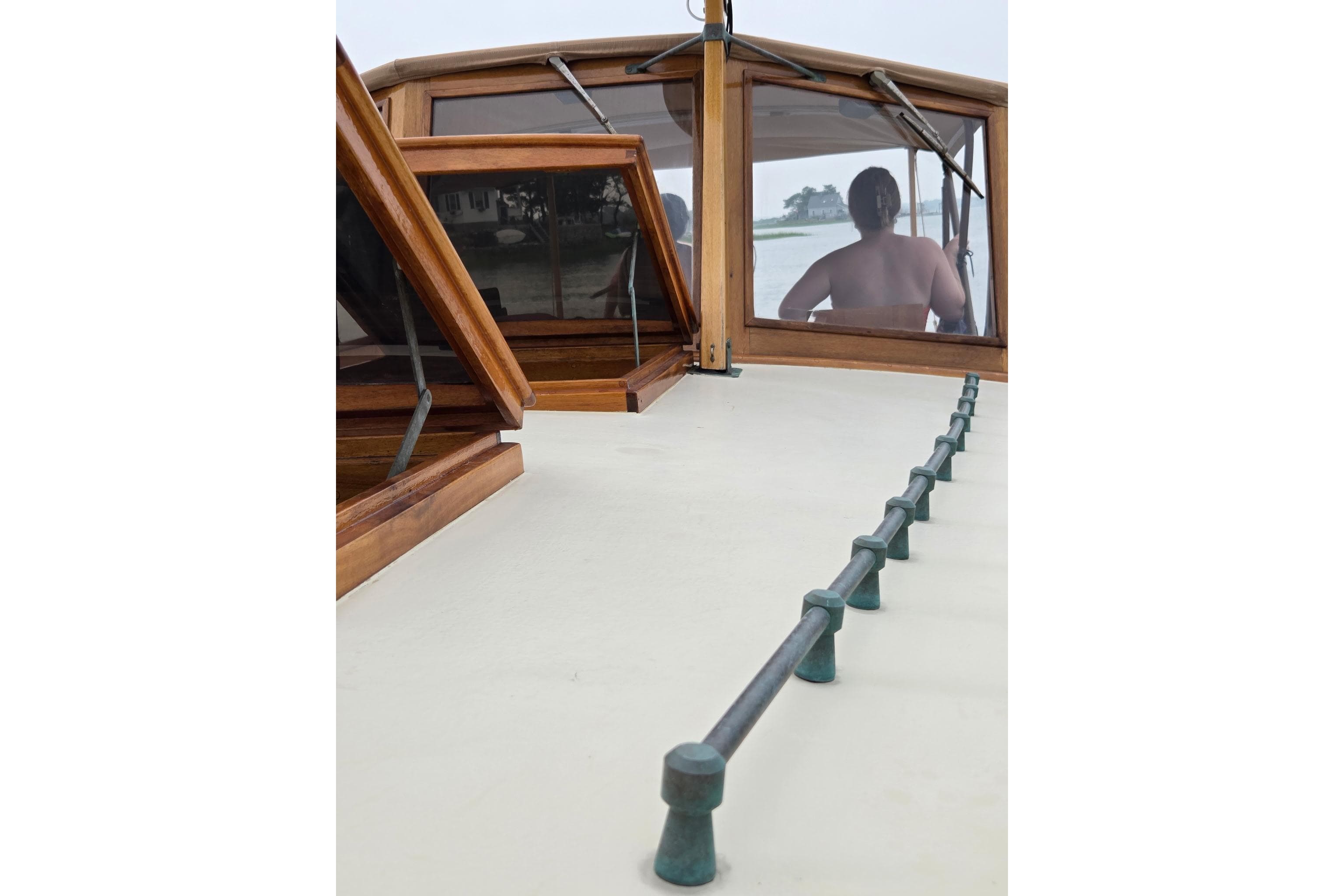 Custom Gannon & Benjamin boat interior with wooden windows, 2005 model.