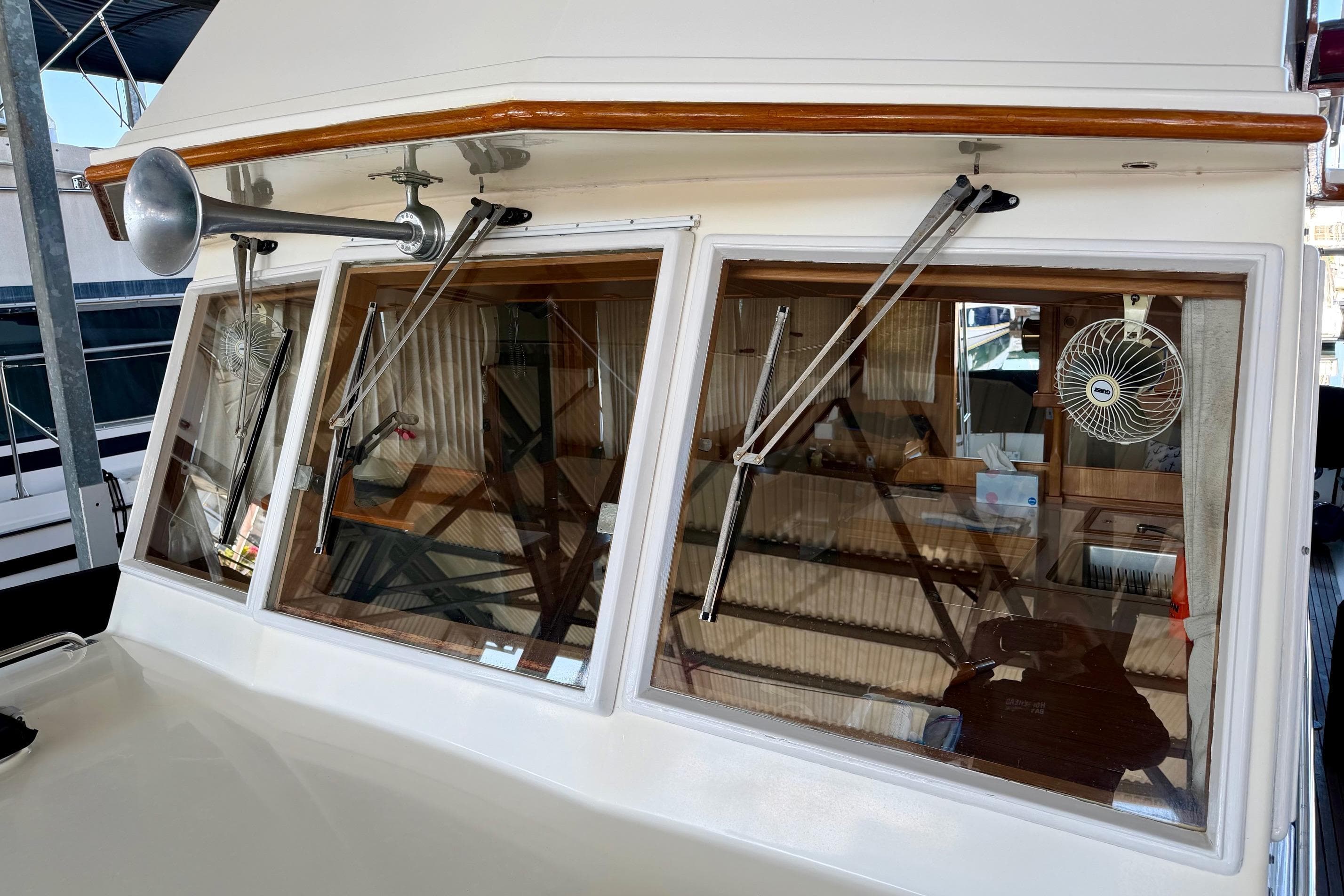 1991 Grand Banks 36 Europa yacht with windshield wipers and fan, showcasing classic design.