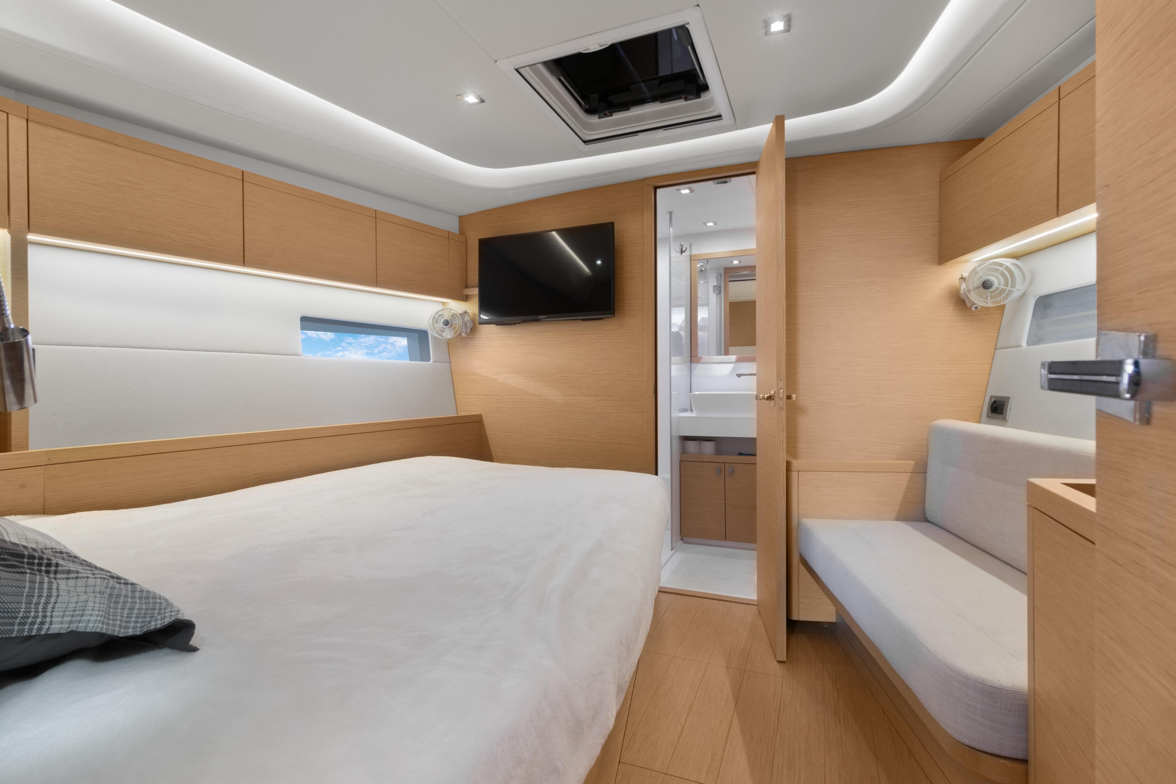 Luxurious interior of 2017 Grand Soleil 52 Long Cruise yacht cabin with modern amenities.