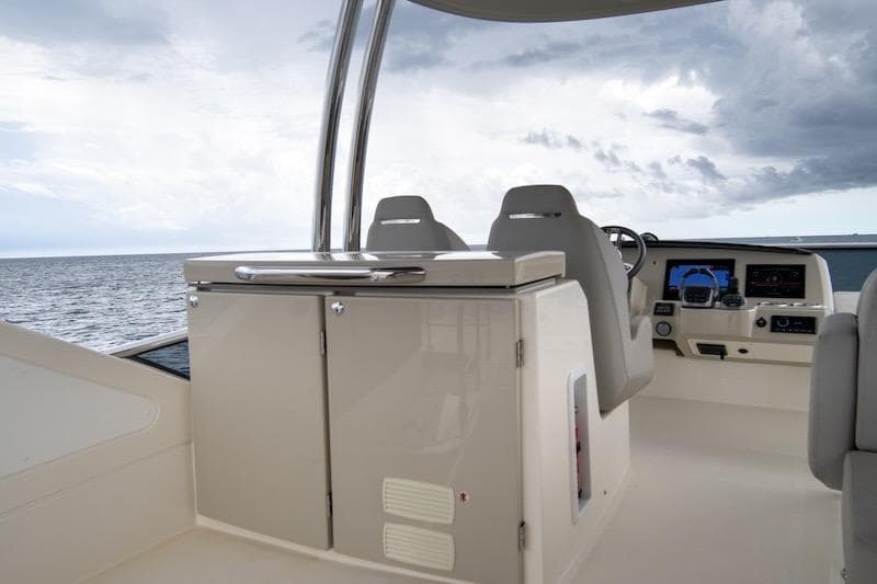 2023 Absolute 62 Fly yacht helm with modern controls and ocean view.