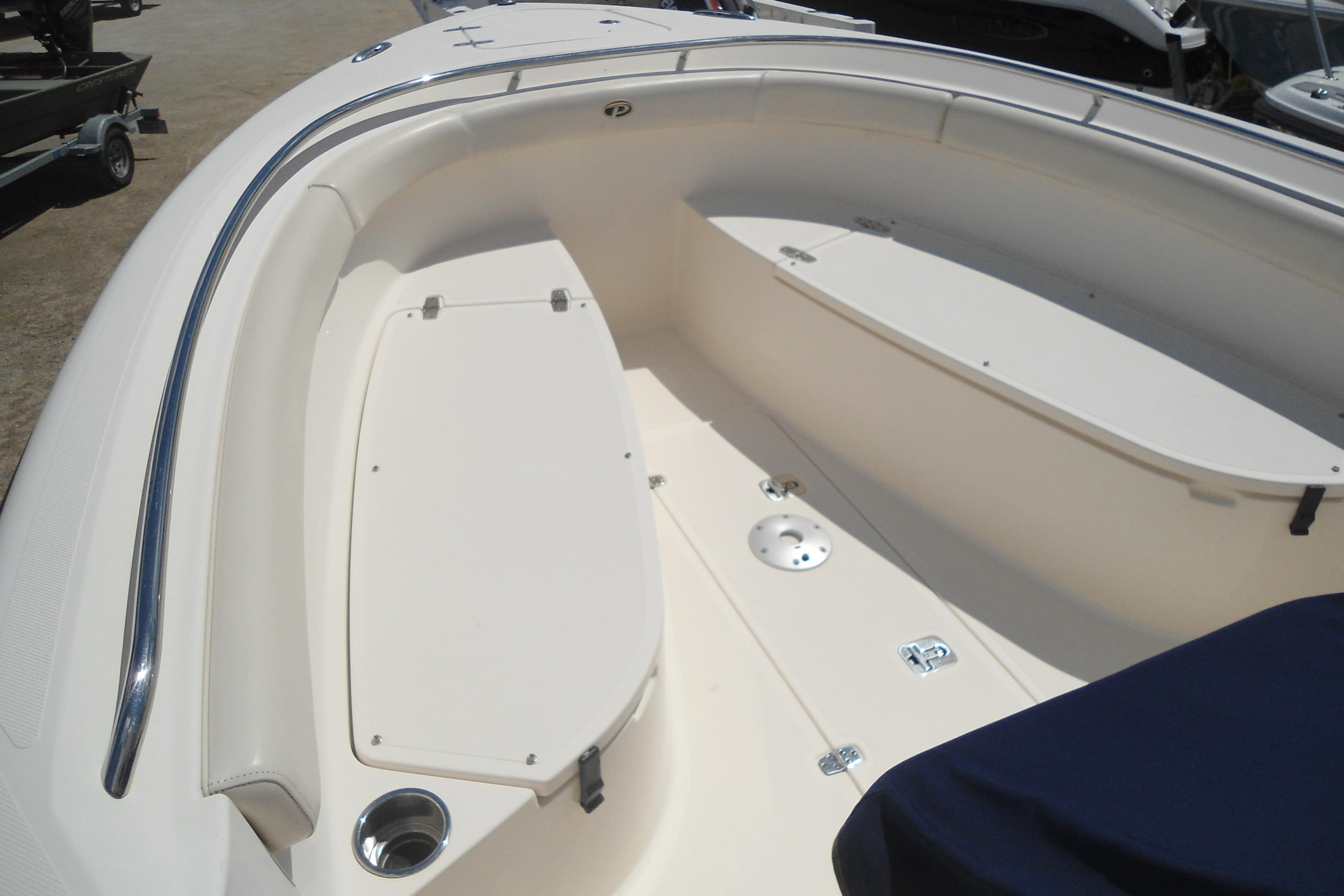 2013 Pursuit C 260 Center Console boat interior with seating and storage compartments.