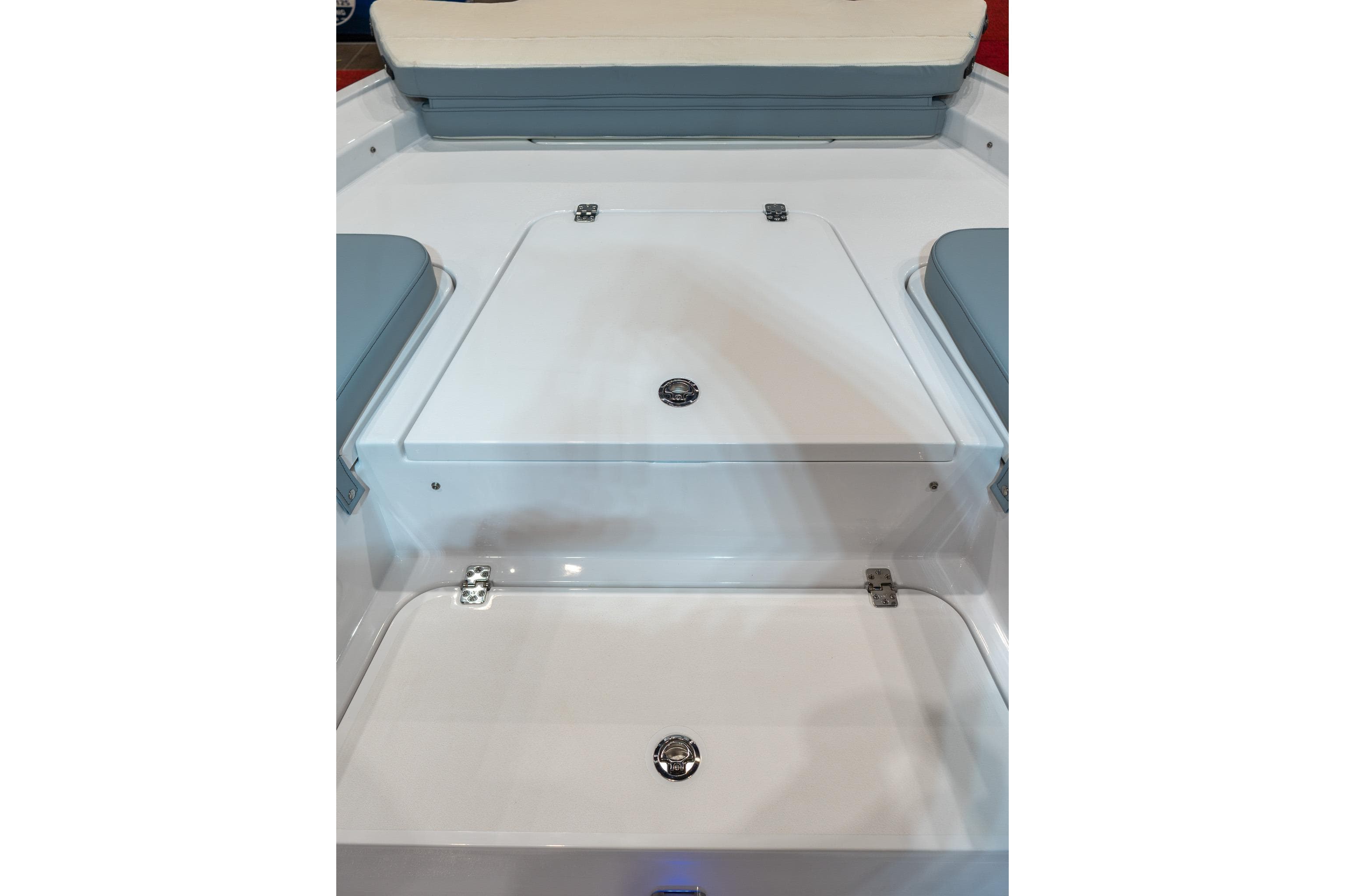 2026 Sportsman Masters 247 Bay Boat interior with cushioned seating and storage compartments.