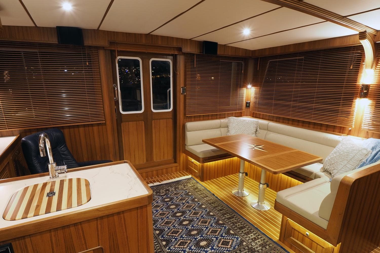 Luxurious interior of 2026 Helmsman Trawlers 43 Pilothouse with elegant wood finishes.