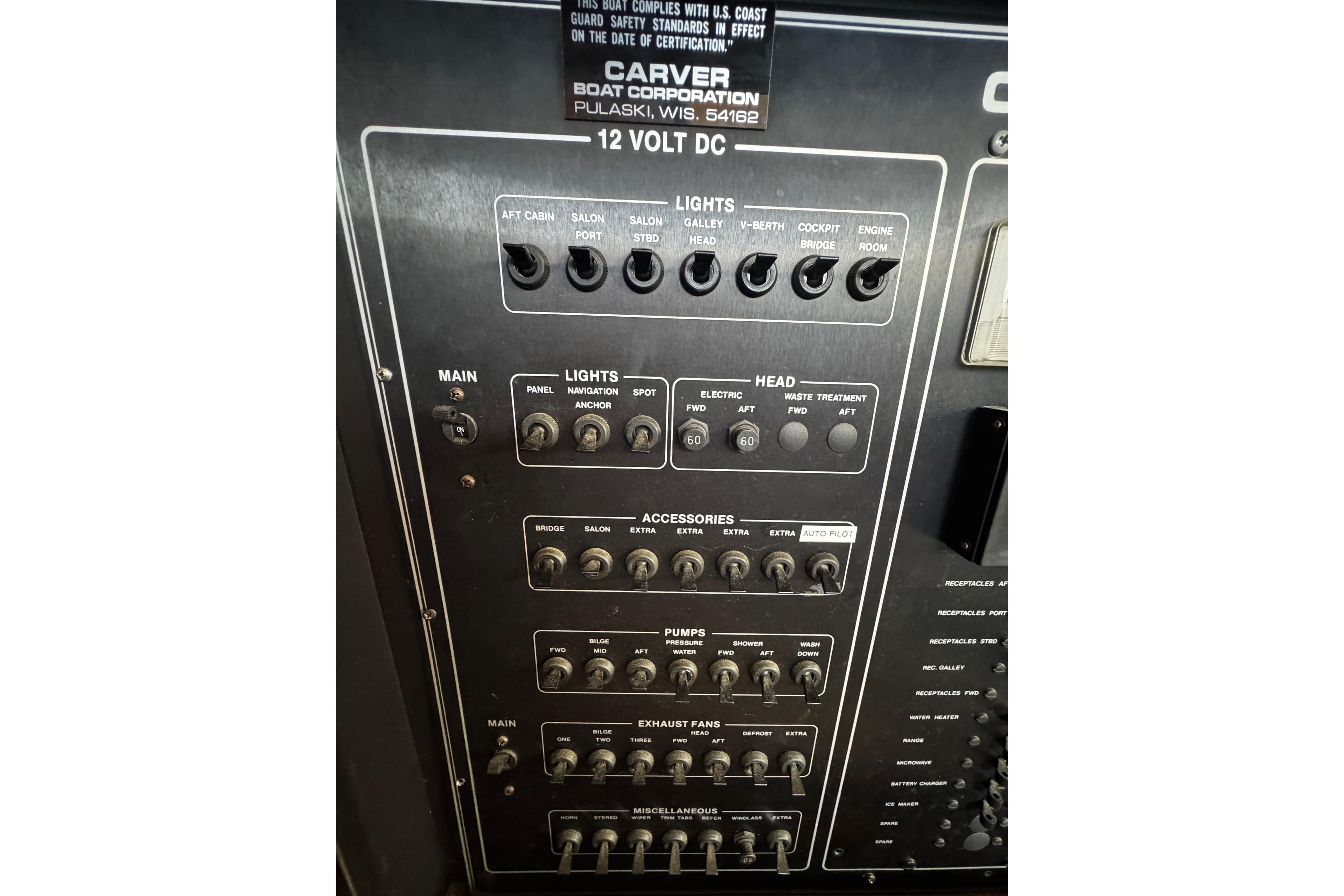 Control panel of a 1986 Carver 42 Aft Cabin Motor Yacht, featuring switches and labels.