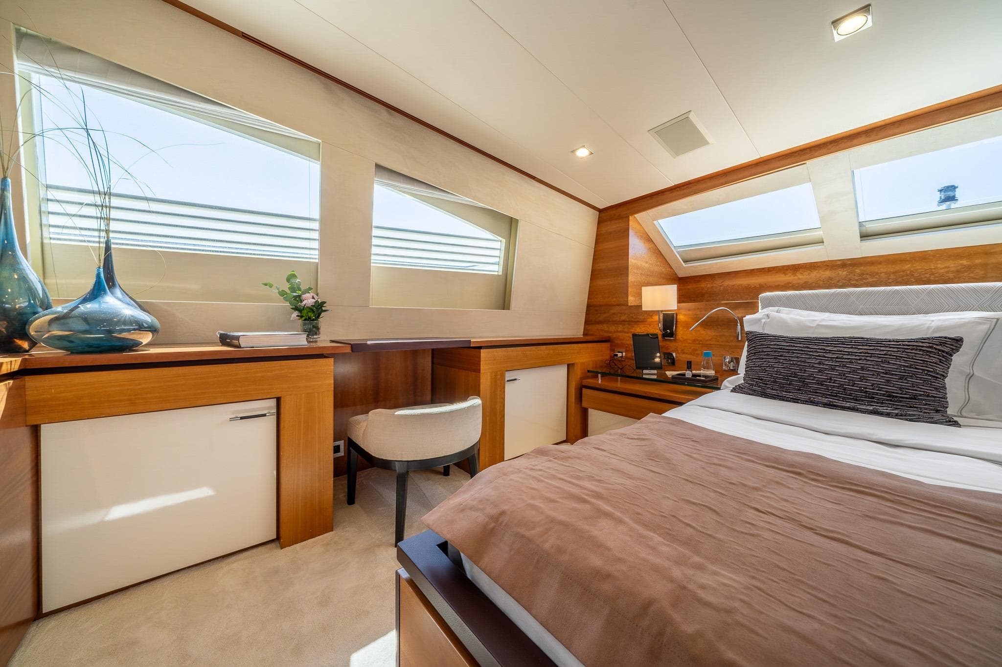 Luxurious bedroom interior on 2011 Guy Couach 121' yacht, featuring modern design and elegant decor.