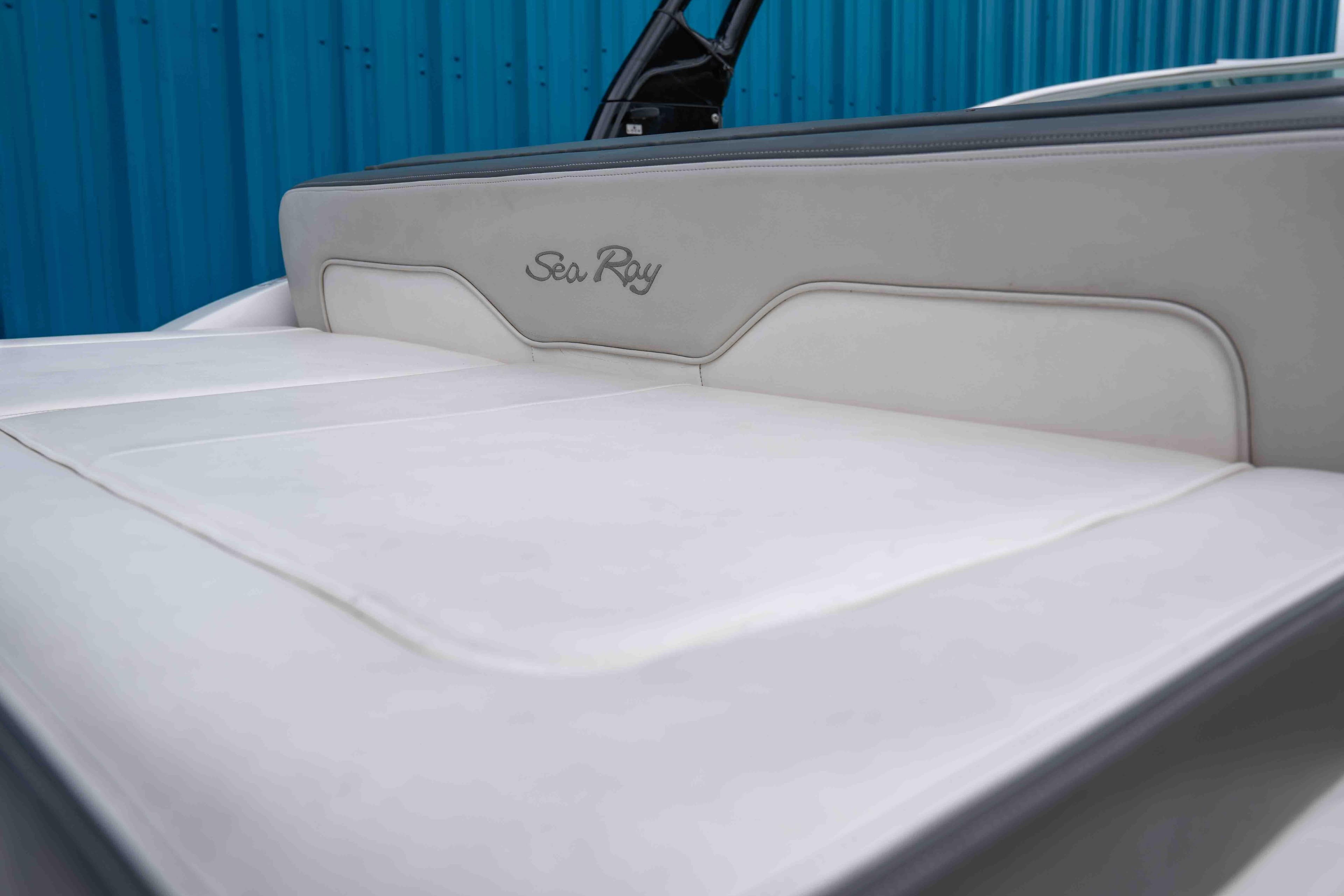 2012 Sea Ray 240 Sundeck boat interior with white cushioned seating.