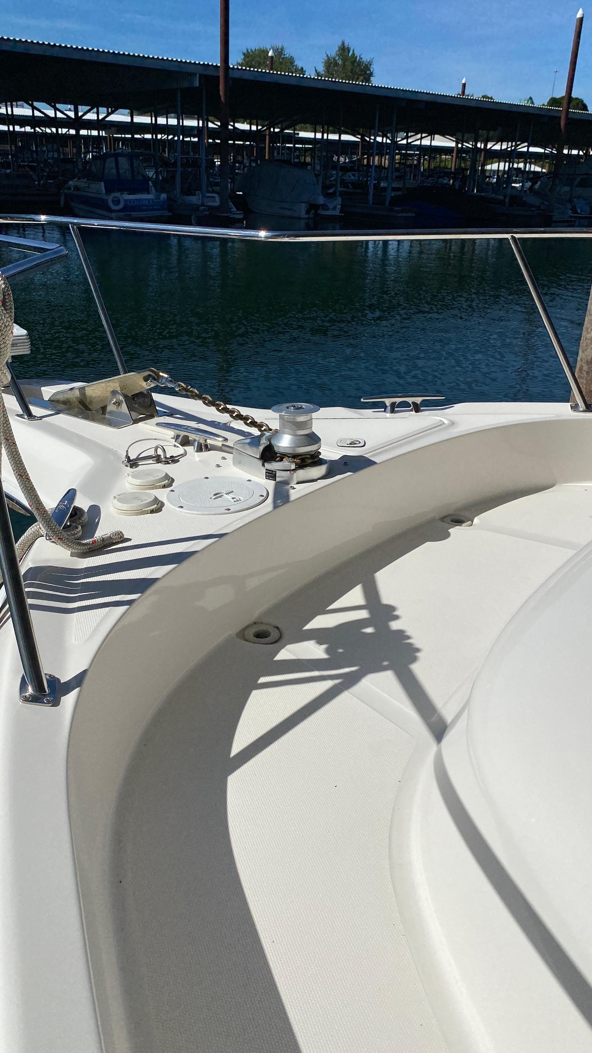 2001 Sea Ray 460 Sundancer yacht bow view at marina.