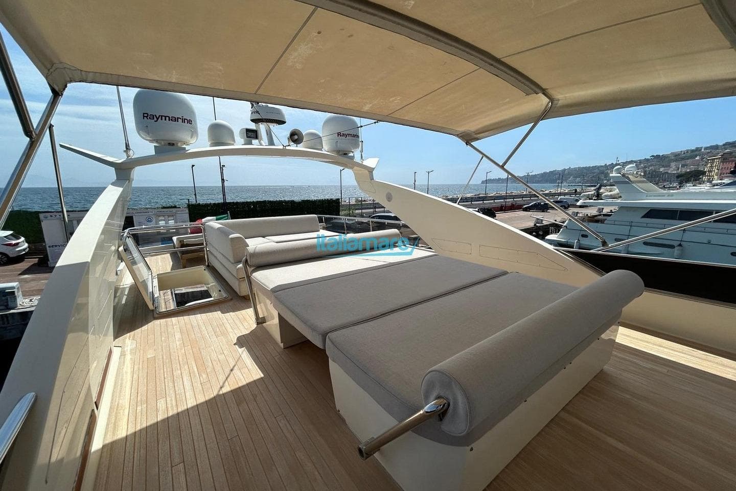 Luxurious 2009 PerMare Amer 92 yacht deck with sun loungers and ocean view.