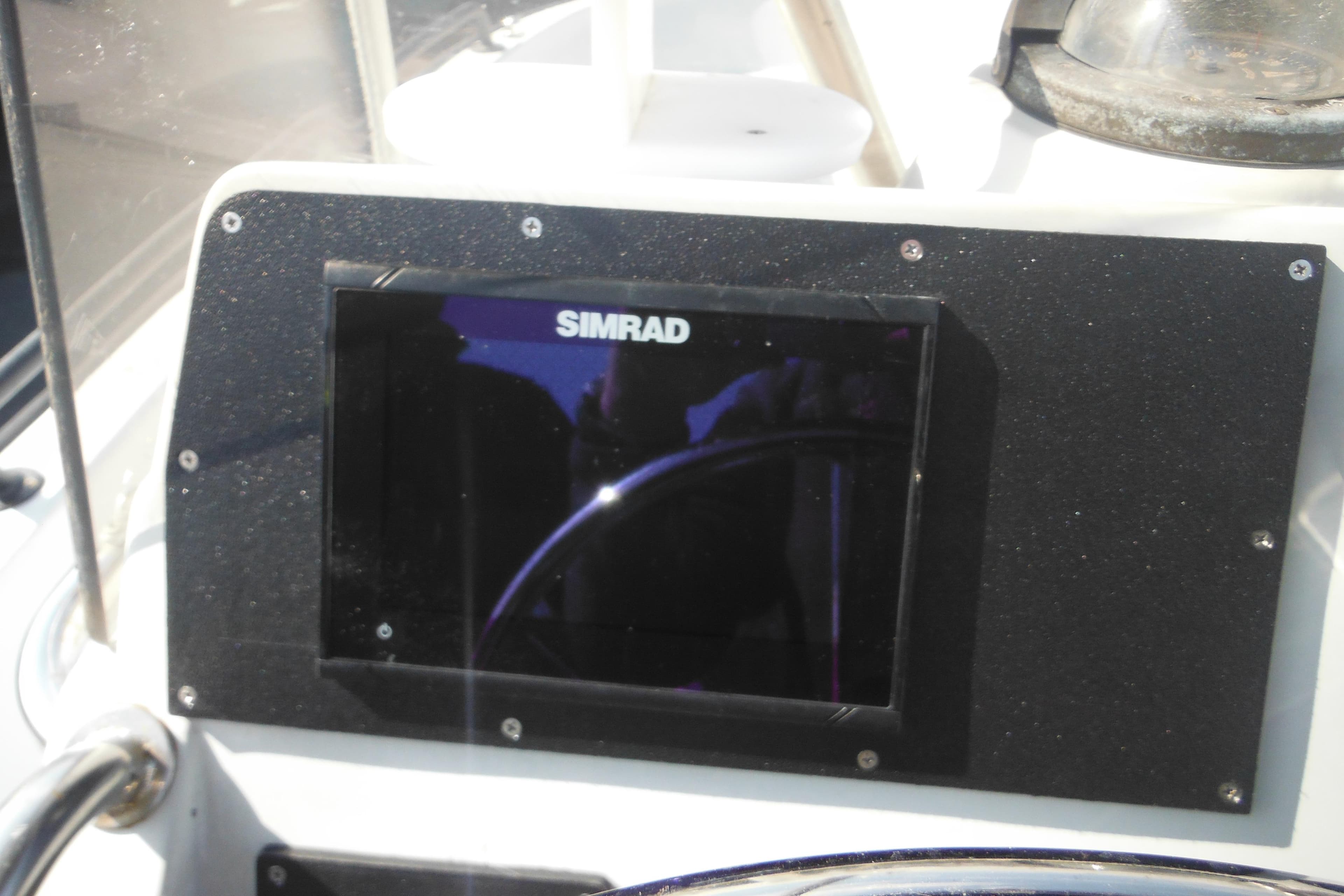 Simrad display on 1990 Boston Whaler Guardian 22 boat dashboard.