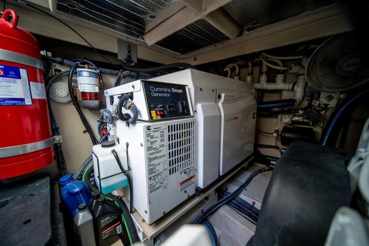 Engine room of 2013 Sea Ray Sundancer 540 with Cummins Onan generator and safety equipment.