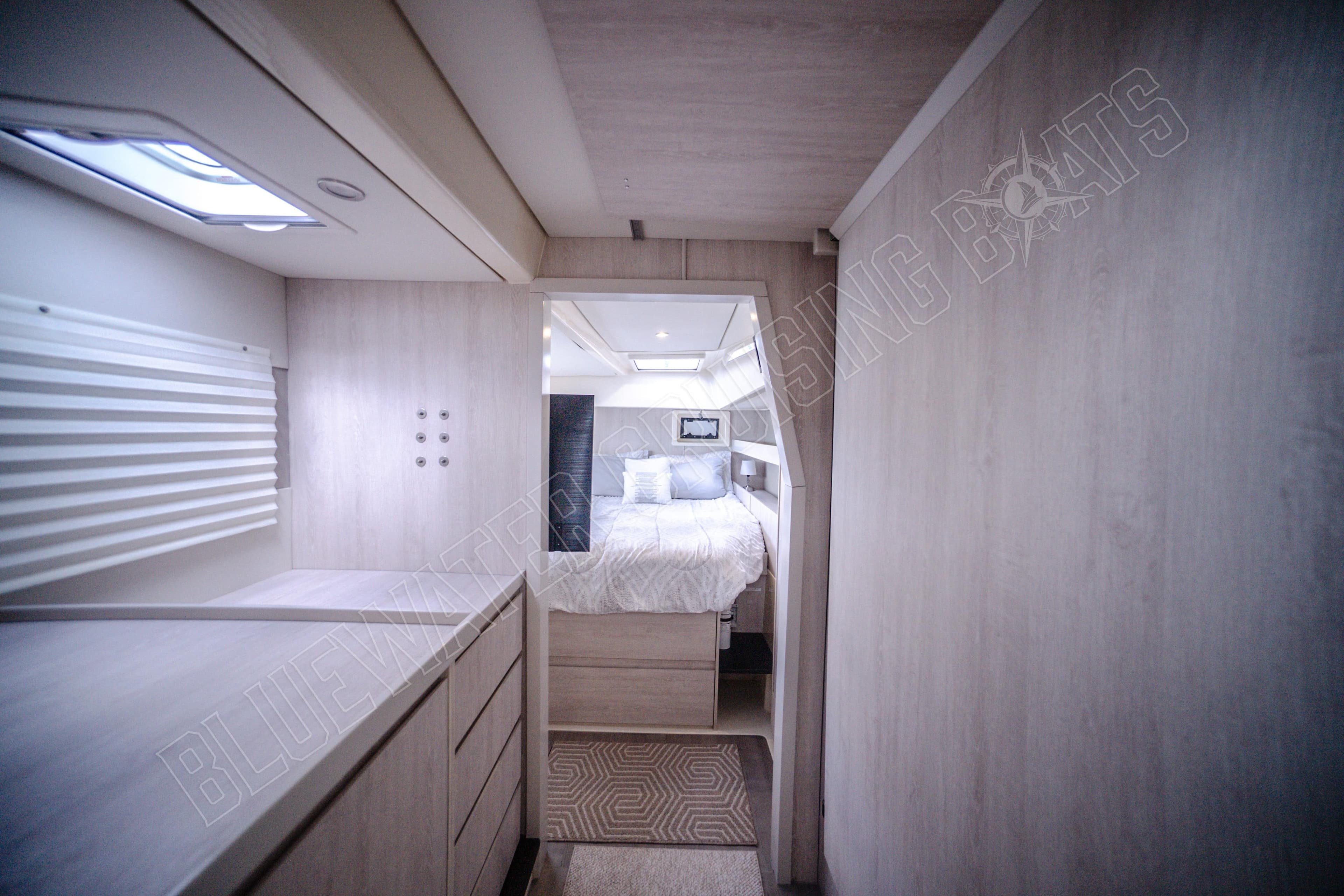 Luxurious interior of 2015 Leopard 48 yacht featuring a cozy bedroom and modern design.