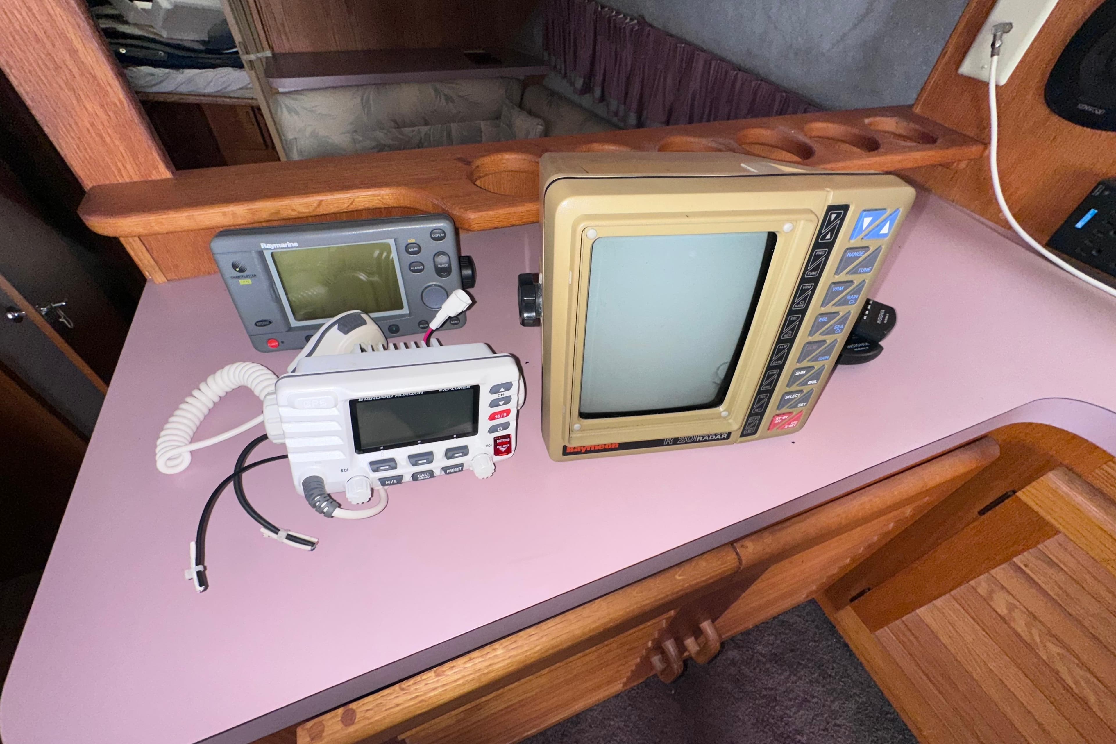 1988 Silverton 37 Convertible boat electronics, featuring vintage radar and communication devices.